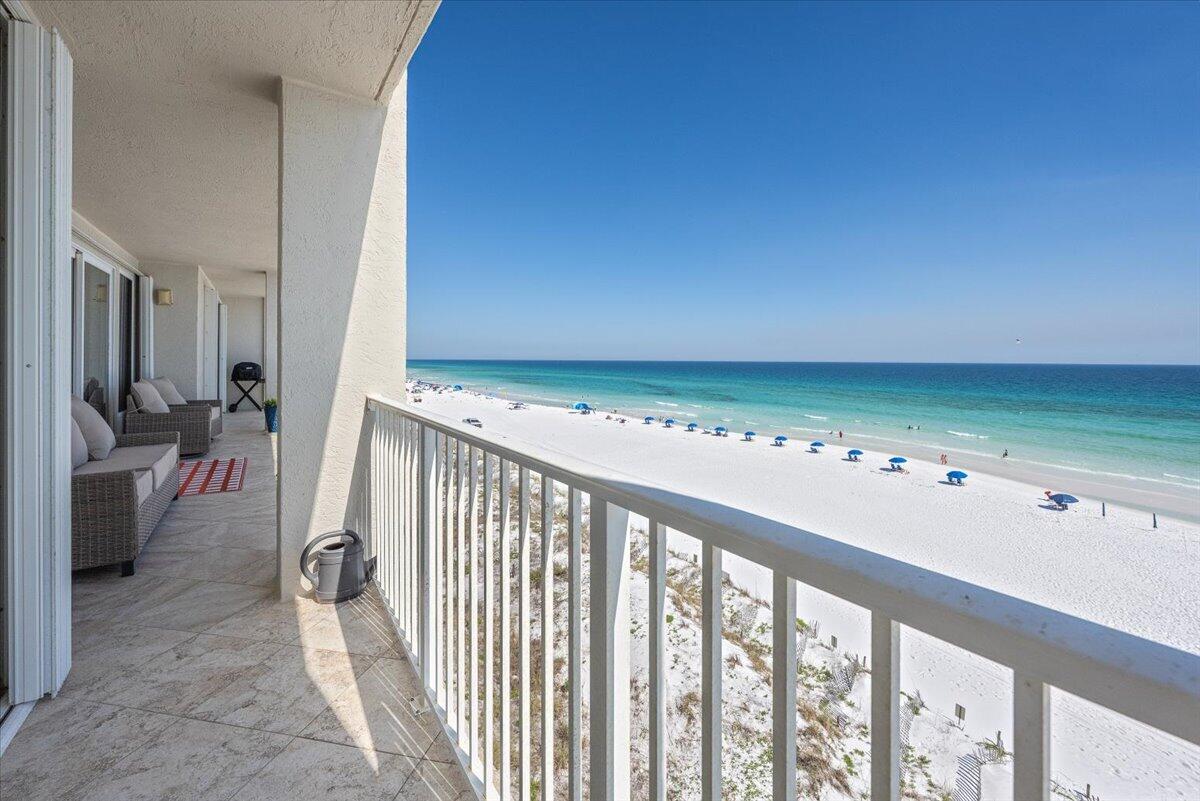 Experience coastal living like never before in this spectacular beachfront end-unit condo, perfectly positioned on the 3rd floor with breathtaking, unobstructed Gulf views from nearly every room. From the moment you walk in, the panoramic beauty of the beach draws you in--captivating your eyes and soothing your soul.

Step onto the expansive 50-foot tiled balcony, accessible from the living area and both bedrooms, and soak in sweeping sunrise and sunset vistas that stretch across the horizon. Whether you're sipping your morning coffee or unwinding with an evening glass of wine, this space becomes your personal slice of paradise.

This 2-bedroom, 2-bath luxury retreat offers an open-concept layout designed for entertaining and a massive 12' kitchen island your morning coffee or evening wine, this extraordinary outdoor space offers the ultimate beachfront experience.

Additional rare features include a private 2-car tandem garage, a separate private storage closet, hurricane shutters, and all the benefits of a boutique Gulf-front complex with only 20 residences. Owners and guests also enjoy private beach access and seasonal beach service provided March through October.

For those seeking peace and exclusivity, short-term rentals are not allowed, creating a quieter and more residential coastal atmosphere.

This exceptional Gulf-front residence offers the perfect blend of luxury, privacy, and breathtaking natural beauty -- an extraordinary opportunity to own a truly special piece of paradise.
