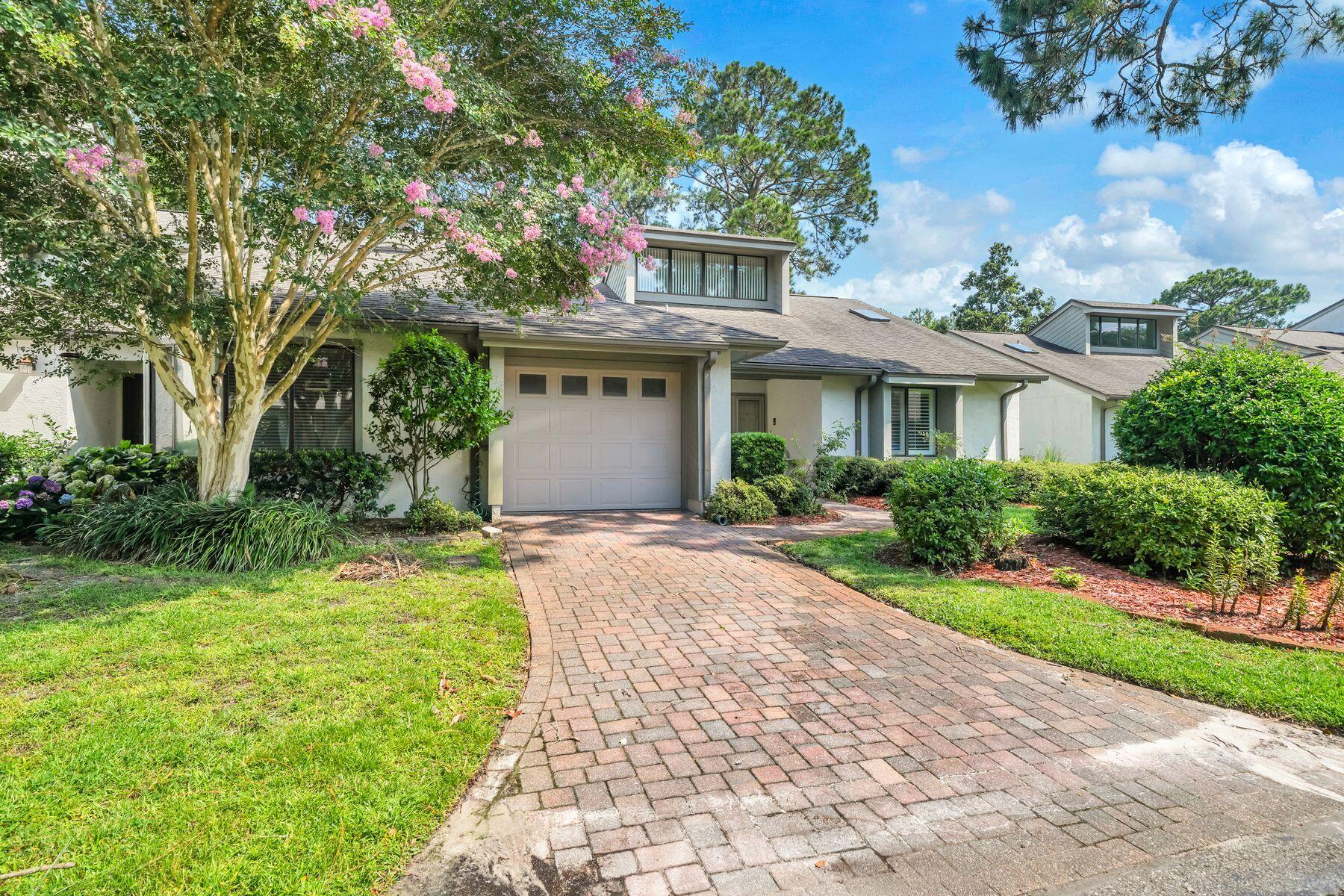 This charming two-bedroom, two-bathroom, single-level home features a functional and spacious floor plan, offering a contemporary feel with vaulted ceilings and abundant natural light throughout. Perfect for entertaining, the home is located on the 2nd hole of the Bay Golf Course. It includes a large living room with a stone fireplace, a formal dining room, an informal dining area off the ample kitchen (which features stainless appliances), and a separate sunroom overlooking the golf course. The property also includes a single-car garage and is well-situated within the Gleneagles community. Bluewater Bay offers resort-style amenities, including swimming pools, a tennis center, pickleball courts, walking trails, and access to golfing, sailing, yachting, fishing, and other water sports. It is within walking distance to the Blue Tee Restaurant and near the LJ Schooners Dockside Restaurant & Oyster Bar. Additionally, it is conveniently located close to hospitals, shopping, and local activities, and is just 12 minutes away from the beautiful white sand beaches of Crystal Beach in Destin, Florida.