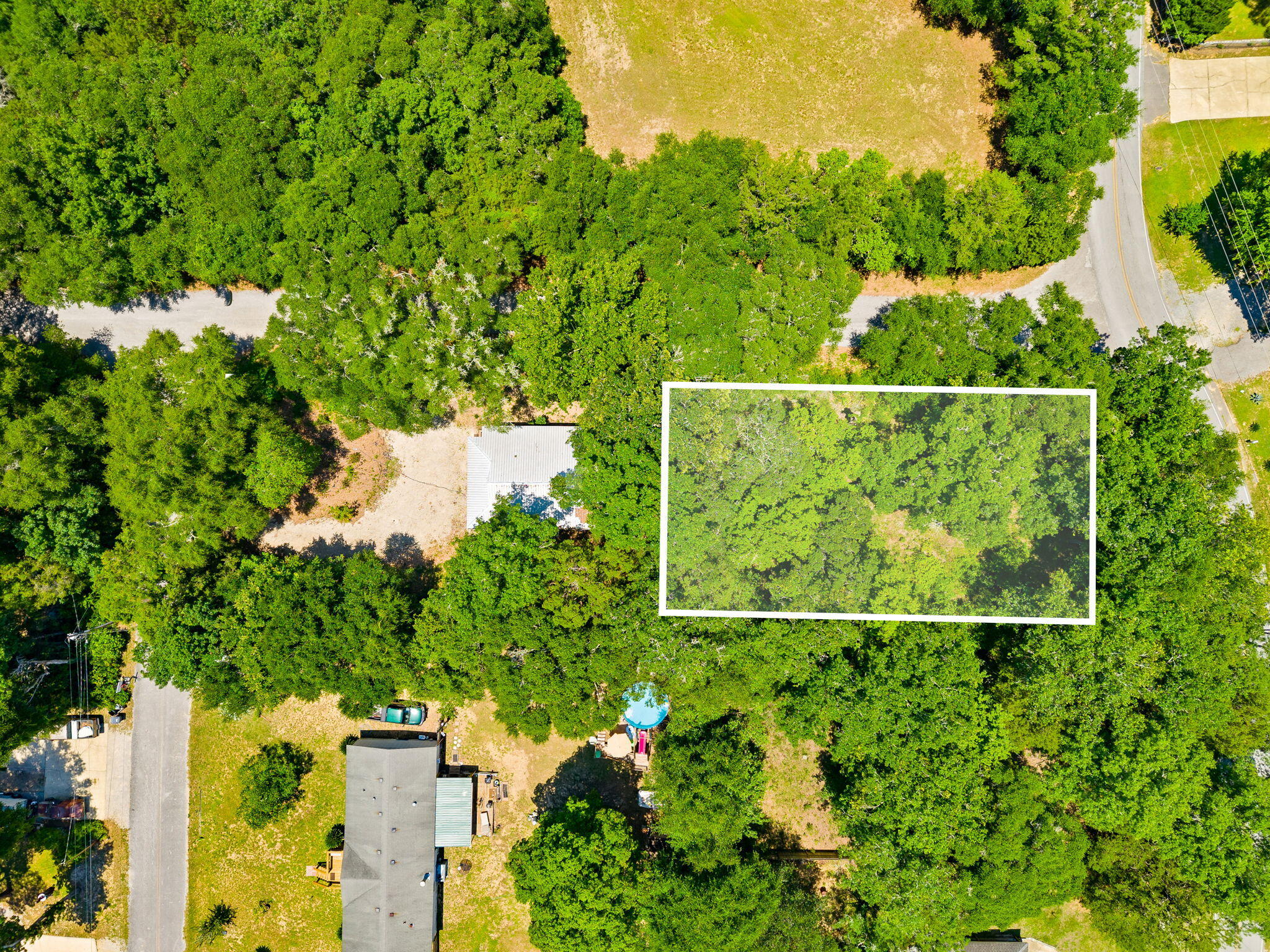 Lot 13 North Ave. Freeport is the perfect location for your new home. This 75x150 lot nestled among mature trees blends country tranquility with the irresistible allure of waterfront proximity. The bay is just moments away and the serene country setting provides a peaceful retreat for your future home. It is only a short walk to the Choctaw Beach Park, with a boat launch. It is perfect for picnics, fishing, and stunning Choctawhatchee Bay views. The Choctaw Beach neighborhood is a hidden gem in the Florida Panhandle. This area offers exceptional value with convenient proximity to the beaches and attractions of the Emerald Coast. The adjacent lot 14 with home next-door may also be purchased if interested.