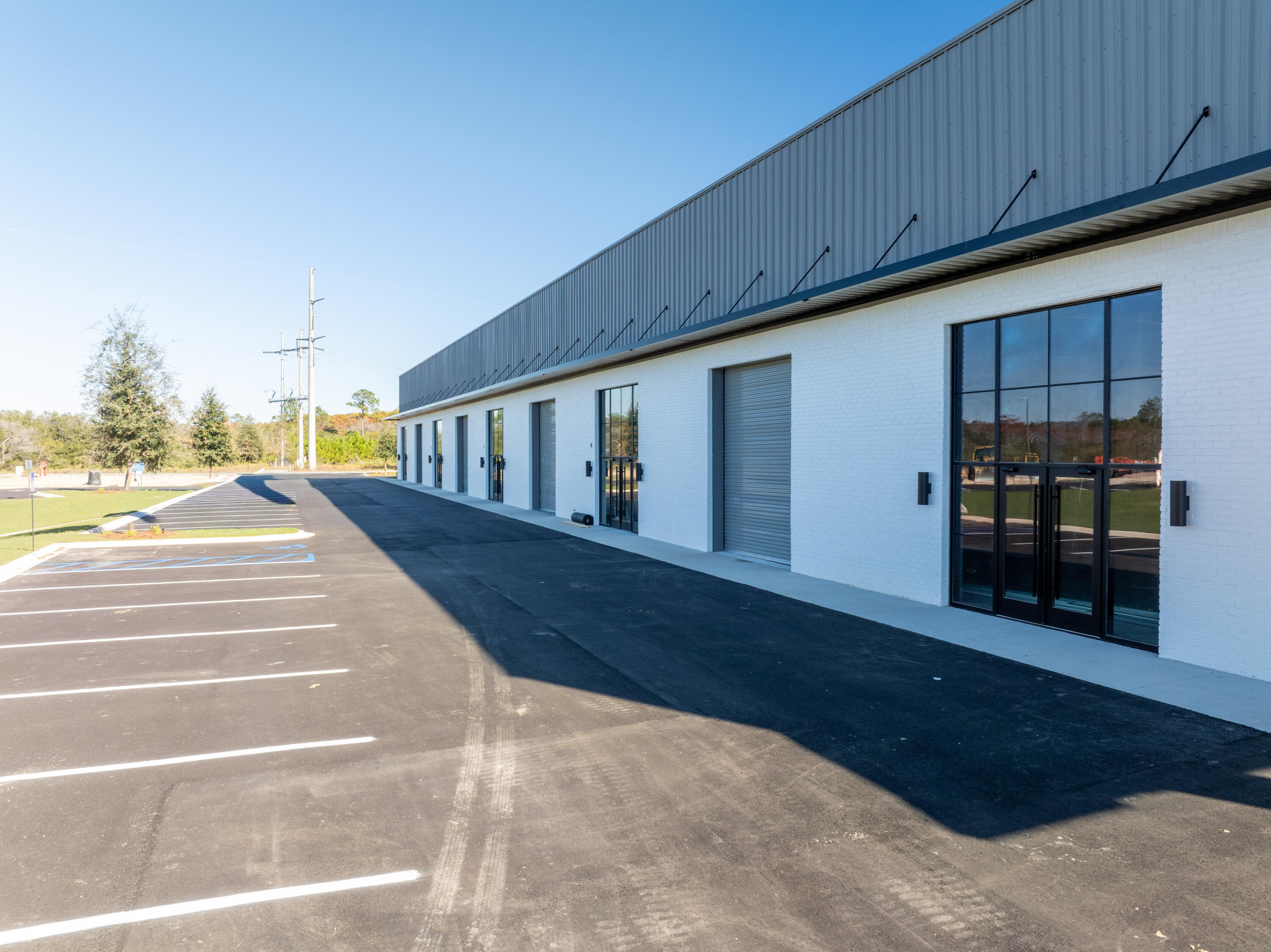 5,100 square feet, 10,200 square feet, or as much as 15,300 square foot now available for lease in St. Joe's South Walton Commerce Park of the flourishing Santa Rosa Beach, Florida market. This new flex space, warehouse building offers exceptional visibility and favorable ingress/ & egress, as well as an abundance of natural light through it beautiful storefront brick and glass façade; also offers a large industrial roll-up door(s); for a larger commitment of space, a loading ramp and dock will add to convenient logistics and receiving. St. Joe's Watersound Origins and 'Bay-Walton Sector Plan' involves 20,000+ rooftops of residential density and a multitude of other mixed uses in proximity to this new warehouse and flex space. The overall site plan is uploaded to this listing, which includes the last freestanding building, 'building c', which will contain 30,000 square feet . Please inquire for further details.