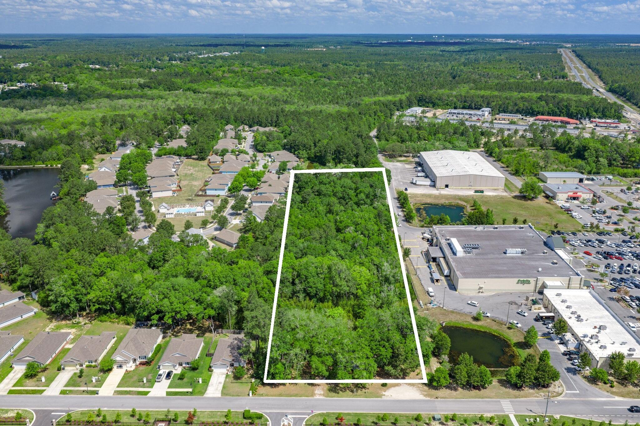 150 Marquis Way presents a rare 4.05-acre development opportunity in the heart of Freeport's explosive growth corridor. The property includes more than $475,000 in prepaid water capacity fees that transfer with the sale, offering immediate utility savings and development readiness. A current Development Order for a hotel provides flexibility for hospitality or mixed-use concepts. The site enjoys dual access from Marquis Way/311 and Highway 20 (Blue Ridge Parkway), with the Marquis connector extending west via bridge to Highway 83A South, ensuring strong regional connectivity.

This parcel sits amid major new development activity including Hammock Bay, a 3,000-acre master-planned community with thousands of existing homes and continuous residential expansion, anchors the population growth driving commercial demand along the Hwy 20 corridor. Nearby Owls Head is emerging as a major mixed-use employment and commercial hub, positioned at the crossroads of Hwy 331 and Hwy 20 and supported by new retail and industrial development activity. Further amplifying long-term absorption, Carr Farms represents one of the most significant planned projects in Walton County, with projections of up to 21,000 new homes and roughly 10 million square feet of commercial space at full build-out. Together, these developments form the backbone of Freeport's rapid transformation and create sustained demand for lodging, retail, services, and commercial uses surrounding 150 Marquis Way.