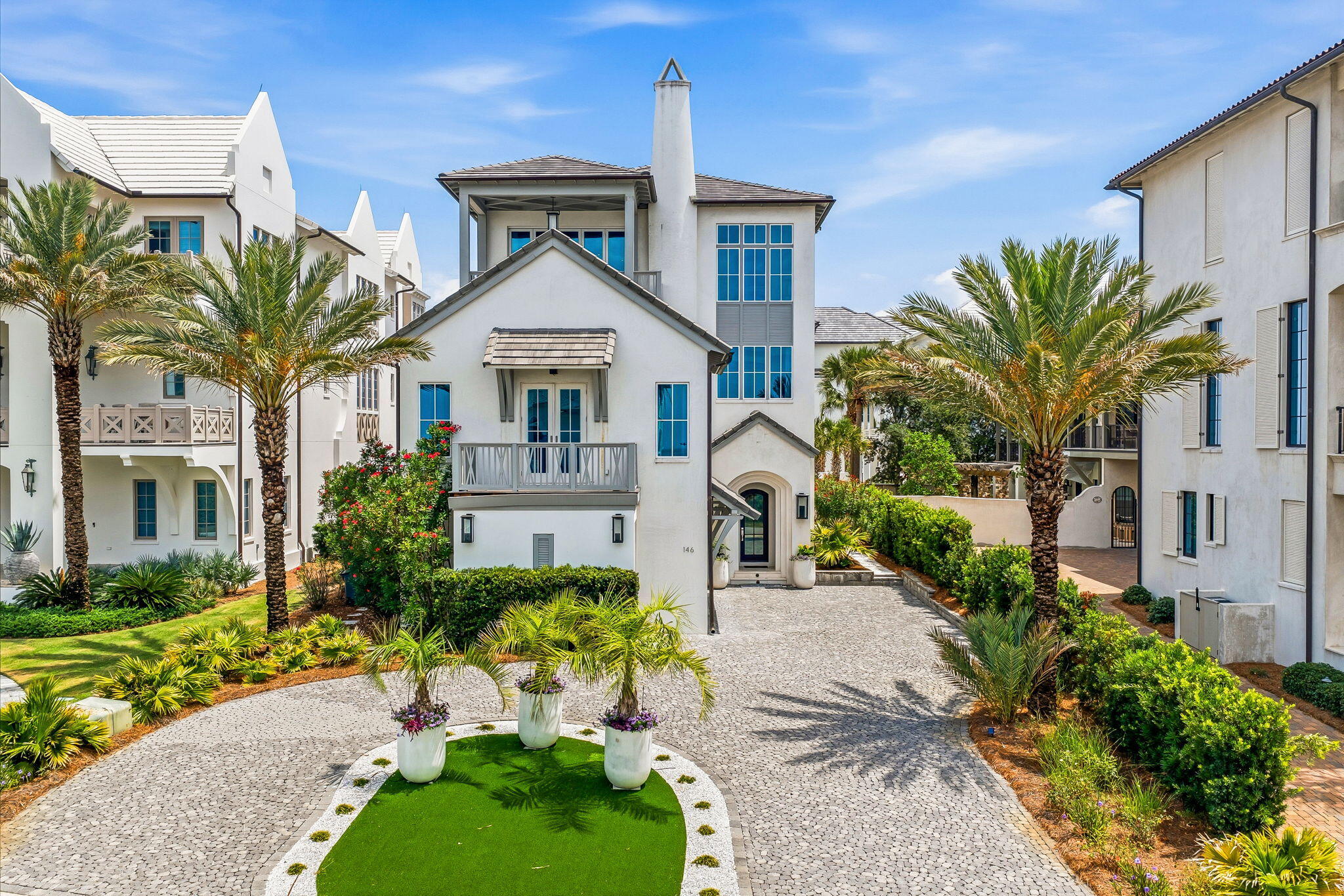 Set within the gated community of Paradise by the Sea, this Gulf-view residence pairs generous scale with one of the most desirable ownership experiences along Scenic Highway 30A, including private beach access and a low-density coastal setting.

Spanning 7,669 square feet, the seven-bedroom, eight-bath home is thoughtfully arranged across three levels with a reverse floor plan designed to capture sweeping views of the Gulf. The upper level serves as the heart of the home, where expansive living and dining spaces, a chef's kitchen, and the primary suite are framed by natural light and coastal vistas.

An elevator connects all levels, while a concrete exterior provides lasting durability. The home's extensive amenity package includes multiple guest suites, a home theater, fitness room with sauna, wet bar, and a variety of gathering spaces designed for both entertaining and everyday living.

Outdoor living centers around a private pool and spacious lounge areas, creating a seamless connection between indoor comfort and the coastal environment beyond.

Paradise by the Sea is one of the few gated communities along 30A offering private beach access, with a limited collection of homes positioned between Alys Beach and Rosemary Beach. Residents enjoy convenient access to celebrated dining, shopping, and recreation while returning to a quieter stretch of the coast. Combining Gulf views, substantial living space, private beach access, and an impressive array of amenities, this residence offers a distinctive opportunity within one of 30A's most established beachfront communities.