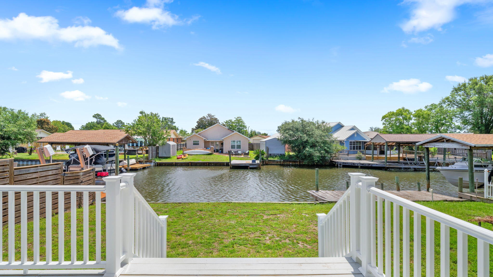 Welcome to 1319 Capri Drive, an end-unit waterfront townhome offering direct North Bay access, room for up to a 35' boat, NO HOA, and fully paid solar panels. Whether you're heading out for a day of fishing, cruising to Shell Island, or simply relaxing by the water, this property delivers the Florida coastal lifestyle so many are looking for.

Following Hurricane Michael, the owners meticulously rebuilt this home from the studs out with the intention of making it their forever home. Quality craftsmanship and thoughtful improvements can be found throughout, including a new seawall, impact-resistant windows and doors, roof, HVAC system, electrical, water heater, exterior siding, flooring, completely renovated kitchen and bathrooms and much more. The rear deck overlooking the canal has also been rebuilt, creating the perfect spot to enjoy morning coffee and afternoon barbecues.

As an end unit, the home benefits from additional privacy, abundant natural light, and only one shared wall, which was rebuilt with soundproofing insulation for enhanced comfort. A portion of the garage has been converted into a heated and cooled fourth bedroom, creating flexible space for guests, a home office, or multi-generational living. 

With short-term rentals allowed, the home also offers excellent potential as a vacation rental or second-home investment.

Conveniently located near Tyndall Air Force Base, Lynn Haven Sports Complex, hospitals, shopping, dining and Panama City's beautiful beaches.