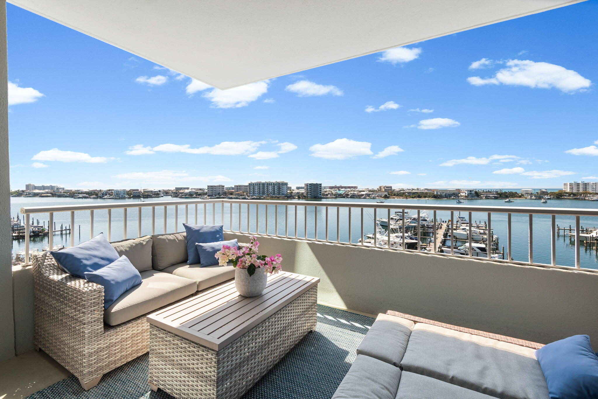 Welcome to an exceptional waterfront retreat in the highly sought-after Destin Yacht Club--where elevated coastal living meets front-row views of Destin's iconic harbor.

Perched on the 4th floor, this beautifully reimagined 2-bedroom, 2-bath residence offers sweeping, unobstructed views of emerald waters, passing boats, and breathtaking sunsets that paint the sky each evening. From the moment you step inside, you're greeted by a light-filled, open-concept design that perfectly frames the harbor beyond.

Every inch of this condo has been thoughtfully renovated with stunning, high-end finishes. The show-stopping kitchen is a true centerpiece--featuring sleek custom cabinetry, striking quartz countertops, designer hardware, stainless steel appliances, and an oversized island ideal for --> gathering and entertaining. The space flows effortlessly into the dining and living areas, all positioned to capture those incredible water views.

The primary suite is a serene escape, where you'll wake up to the harbor just beyond your windows. The spa-inspired ensuite bath has been completely transformed with dual vanities, custom tilework, modern fixtures, and a luxurious walk-in shower that rivals a boutique hotel experience. Two walk in primary closets allow for full time living without sacrificing space. 

The second bedroom is graciously located at the front of the condo and split from the primary sleeping quarters. A second full bathroom is beautifully updated and features a custom walk-in tiled shower. The guest hallway also boasts a bunk nook for additional sleeping space or storage. It the perfect spot to customize and make it fit your luxury living needs. 

Step outside onto your private balcony and take in the energy of Destin Harbor--watch fishing boats head out at sunrise, dolphins playing in the distance, and fireworks lighting up the sky on summer nights. This is coastal living at its finest!

Destin Yacht Club offers an unmatched coastal lifestyle with an impressive collection of resort-style amenities designed for both relaxation and connection. Residents enjoy access to a waterfront pool overlooking the harbor, a fully equipped fitness center, beautifully appointed gathering spaces, and a community kitchen perfect for hosting friends and family. The waterfront bar and entertaining areas create the ultimate setting for sunset cocktails, while the game room and shared spaces add to the vibrant, social atmosphere.

For boating enthusiasts, private boat slips are available for purchase, along with a dedicated dock, fish cleaning station, and seamless access to the harbor for days spent on the water. Additional conveniences include private storage closets and direct access to the HarborWalk--placing dining, entertainment, and the best of Destin right at your fingertips.

This exclusive, non-rental community is reserved for full-time residents and second homeowners, offering a more private, peaceful environment that truly sets it apart. Here, you're not just purchasing a condo--you're stepping into a refined waterfront lifestyle in one of Destin's most coveted locations. Welcome home!