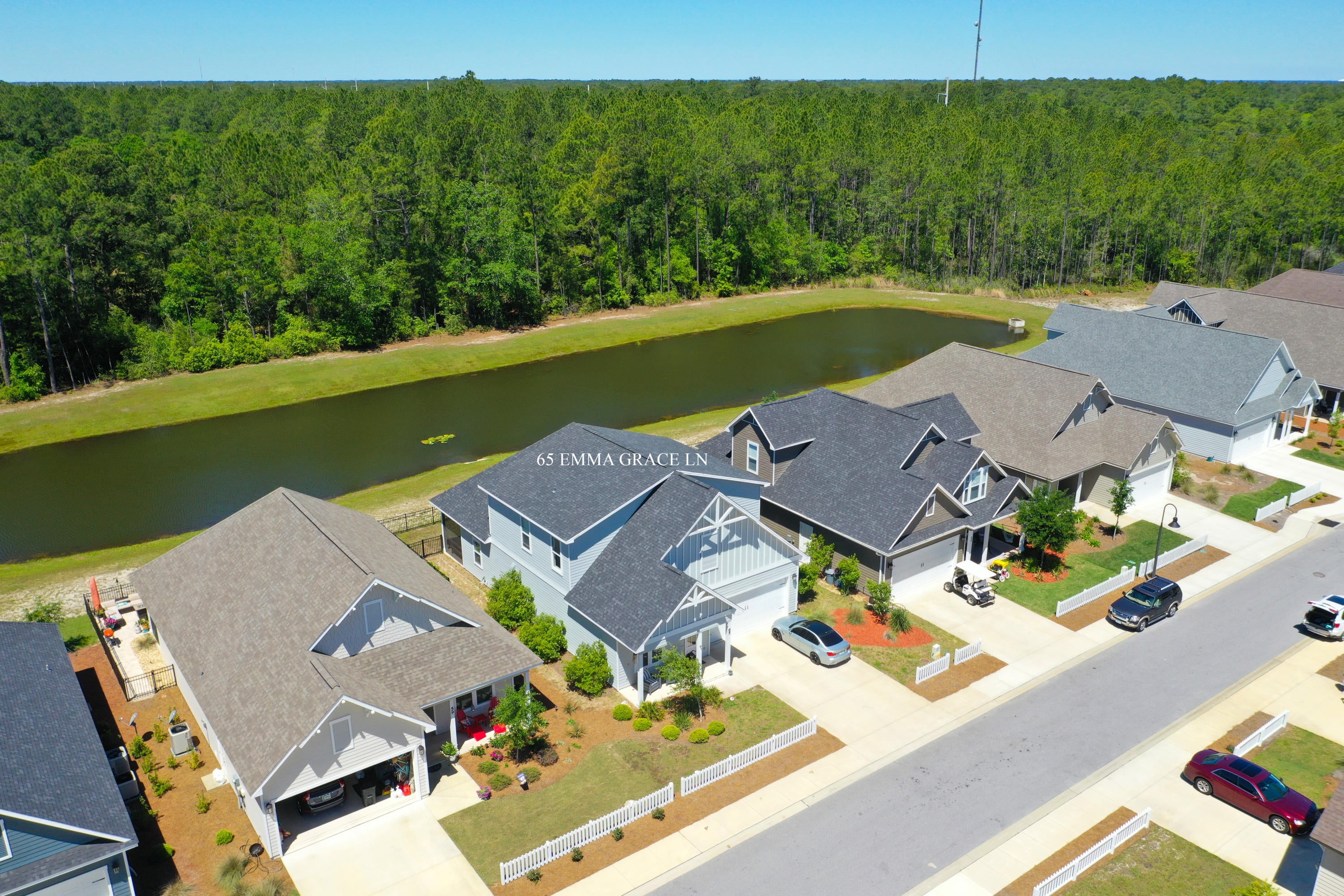 Enjoy lakefront living in this spacious four-bedroom, three-and-a-half-bath home offering approximately 2,880 square feet, complete with a dedicated office, versatile upstairs loft, and two-car garage in the Paradise Cove community.

The main level features an open-concept living area with a fireplace, a spacious kitchen with stainless steel appliances, granite countertops, white cabinetry, wood flooring, and crown molding throughout. The primary suite, private office with double-door entry, powder bath, and laundry room are all conveniently located on the first floor. Upstairs, the loft provides flexible space for a second living area, home office, media room, or hobbies, along with a guest bedroom featuring an en suite bath, two additional bedrooms, and a full bathroom.

Outdoor living includes a screened porch overlooking the lake, a fenced backyard, outdoor shower, native Florida landscaping, and a paver driveway. Residents of Paradise Cove enjoy a community pool and sidewalks throughout the neighborhood.

Ideally located just minutes from Scenic Highway 30A, the area's white-sand beaches, shopping, dining, and everyday conveniences, this home also offers easy access to US Highway 98 and is conveniently located near South Walton schools, including Emerald Coast Middle School. Its central location provides convenient access to Destin, Panama City Beach, Eglin Air Force Base, Hurlburt Field, and Tyndall Air Force Base, making travel throughout the Emerald Coast simple and Convenient.