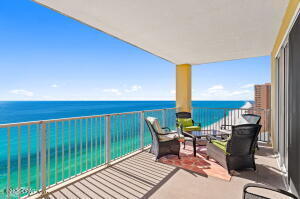 Tropic Winds 1709 is an absolutely beautiful, west-end unit, 2 bedroom, 2 bath, condo with upgrades galore! The seller has spared no expense while decorating this non-rental, gulf-front, beach sanctuary. The foyer greets you with elegant wainscoting that also extends around the back facing of the kitchen bar. Upgraded bamboo flooring flows through out the living areas, bedrooms, and kitchen while the bathrooms have upgraded tile flooring. The upscale country/coastal decor flows through every room including the furnishings, decor, and light fixtures. The stocked kitchen features wrap-around cabinetry with ample storage. The dining area and kitchen bar comfortably seats 9. The living room provides two sofas for plenty of relaxation while enjoying views of the gulf. Both the living room and