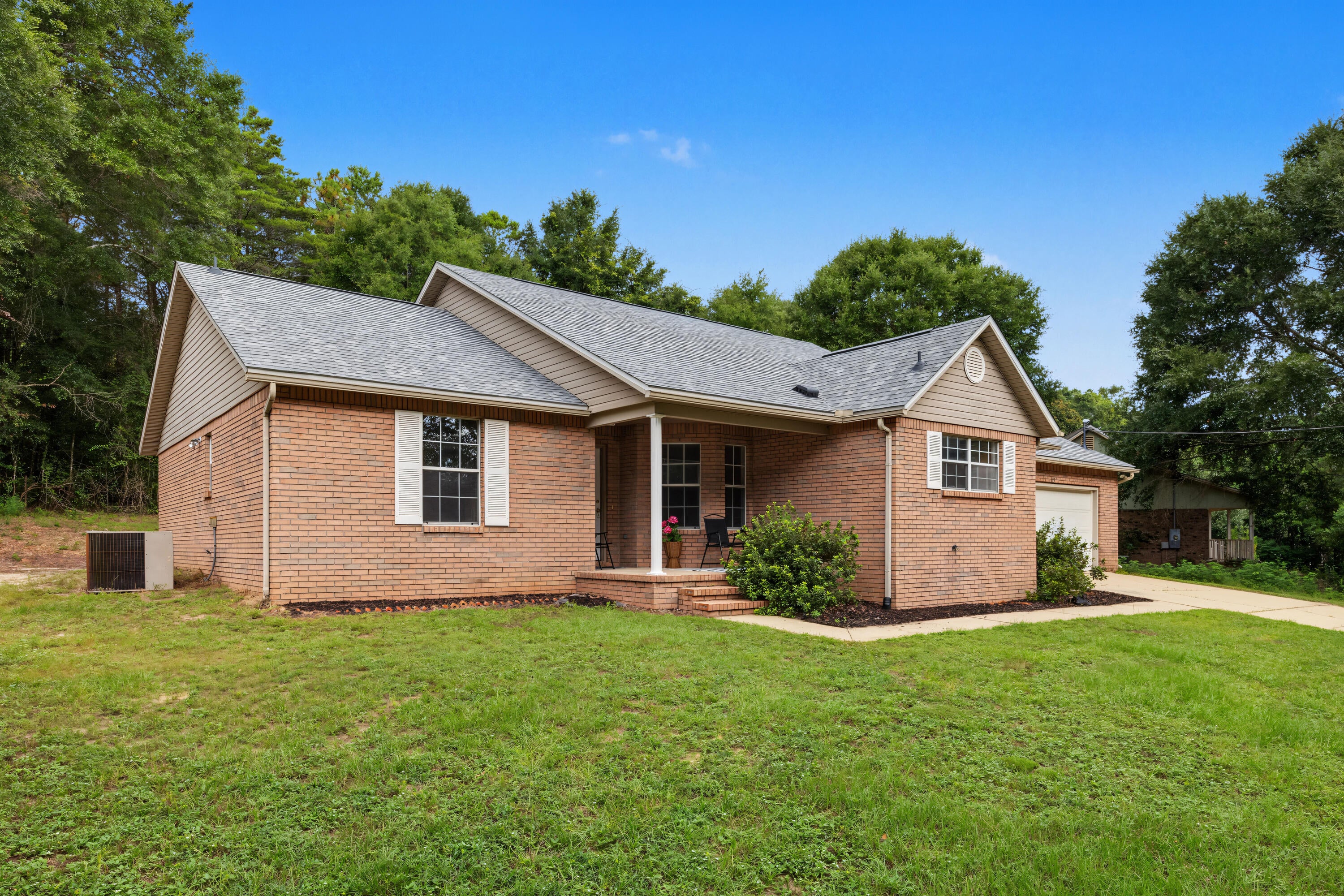 A one-of-a kind Crestview home, built for a lifetime of memories.
Some homes are simply houses. Others feel like the place where life is supposed to happen. Welcome to 213 Hunter Dr in North Crestview, FL - a truly unique opportunity to purchase a custom-built  home that has never before been offered for sale. 
Tucked away on a low-traffic Cul-de-sac, this special property offers the space, character, and timeless design that are becoming increasingly difficult to find in Crestview. And while many homes today come with renovations that leave buyers wondering what might be hiding behind the walls, this home offers something refreshingly different: the original craftsmanship and character remain intact, with a brand-new roof already in place. No unexpected DIY surprises. No mystery renovations. Just an opportunity to make a well-bult, one-of-a-kind home your own. From the moment you step through the large entry foyer, you'll notice the classic design and generous proportions. The split-bedroom floor plan provides privacy while creating an inviting flow throughout the home.  
The heart of this home is designed for gathering. The huge dining room provides plenty of room for long dinners, holiday celebrations, birthday cakes, and a table surrounded by people you love. The separate breakfast area is perfect for slow mornings and everyday meals, while the kitchen offers tons of counter space, new appliances and  solid wood custom cabinetry. Large windows fill the home with beautiful natural light, creating a warn and welcoming atmosphere throughout the day. And when the evenings come, imagine gathering around the fireplace for cozy movie nights knowing that the fireplace has never been used and is ready for its first chapter to be with you.
The spacious primary suite is a retreat of its own, featuring a large master bathroom with an oversized double vanity and TWO walk in closets. You will also enjoy the oversized shower, custom cabinetry and six foot whirlpool tub. There is room here for real life- not just staging.
Outside, you'll find the kind of space that makes everyday living easier. The oversized garage offers room for vehicles, shortage, hobbies, or all the things life accumulates along the way. The driveway is large enough to accommodate family, friends, guests, and everyone coming for holidays. A yard building adds even more flexible storage space.
And perhaps one of the best features? NO HOA dues.
This is a home for people who want more than a house.  It is for those who want to gather around a big table. Folks who want quiet evenings. People who need room for generational growth. Those who love cooking recipes handed down. People who will love neighborhood evening walks, holiday traditions, birthday celebrations, Sunday dinners, and years of ordinary moments that become memories you treasure most.
Located in Crestview, FL this property offers the opportunity to own something truly special- a custom, one-of-a-kind home with timeless character, a new roof, generous living spaces, over-sized garage, large driveway, yard building, split floor plan and no HOA.
Homes like this don't come along every day.
213 Hunter Dr isn't just waiting for its next owner. It is waiting for the next chapter of its story, someone who will continue to love it like it has been since it was built.
