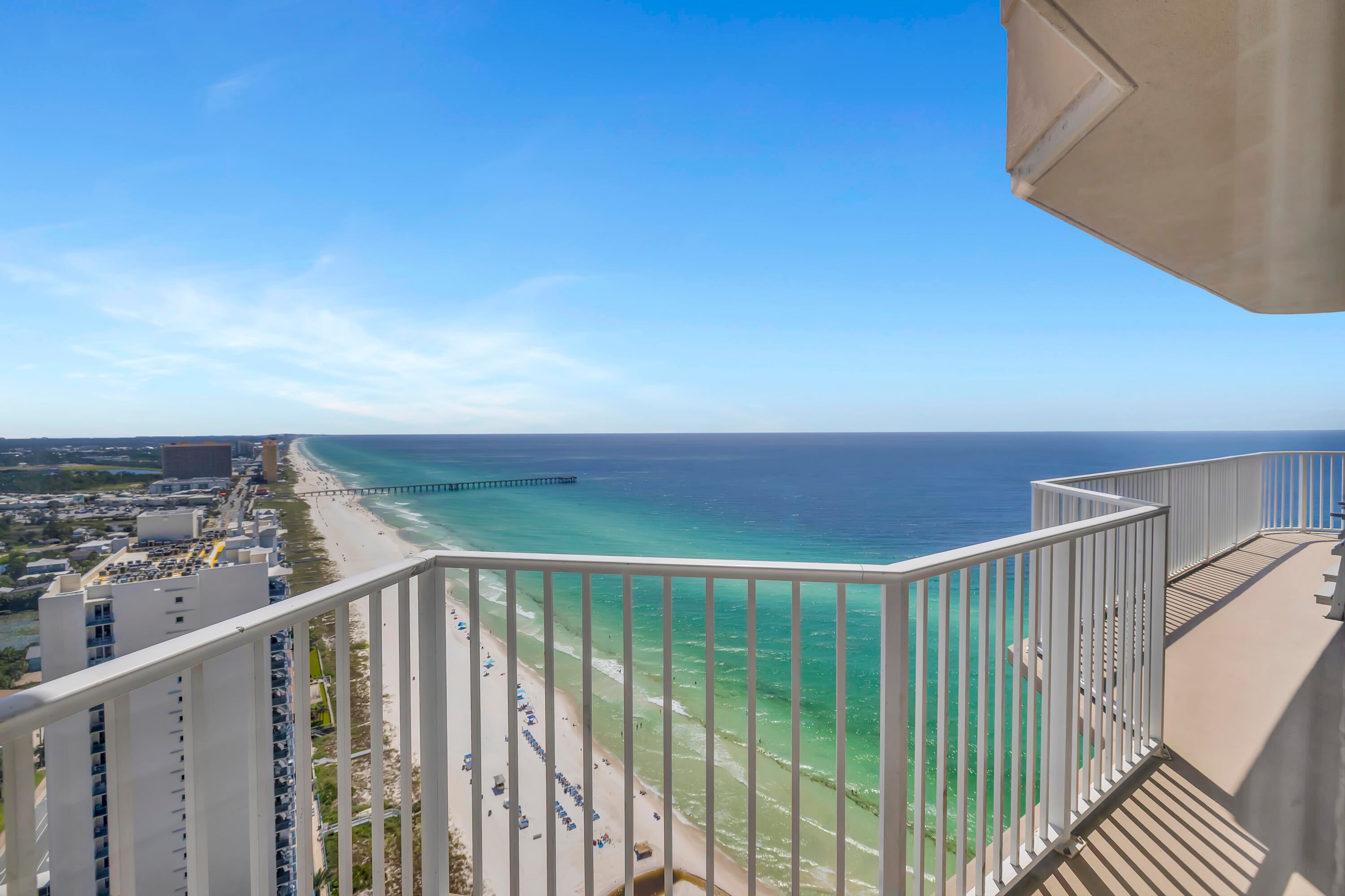 TOP OF THE EMERALD COAST. SUNRISE TO SUNSET. UNOBSTRUCTED COASTLINE VIEWS. Tidewater Penthouse 3017 occupies the 30th and highest residential floor of Tidewater Beach Resort, delivering the highest residential vantage point available anywhere in Northwest Florida. From this top-floor corner position, the wraparound balcony and floor-to-ceiling windows open to turquoise Gulf waters, an expansive horizon, and coastline views stretching in both directions. Watch the sunrise over the eastern coastline, the sunset over the Gulf, and Fourth of July fireworks over the Pier and SkyWheel at Pier Park, all from one extraordinary residence. When the goal is to be above it all, there is nowhere else to go.
This 3-bedroom condo with a bonus bunk area and 3 full bathrooms has been fully renovated to the studs and finished to an exceptional standard. The residence includes two en-suite bedrooms, an additional bedroom, and a dedicated bunk area, with sleeping accommodations for up to 10.
Inside, the attention to detail is immediately apparent. Fresh paint, updated interior doors, remodeled bathrooms with upgraded tile, upgraded flooring, shutters, granite countertops, updated cabinetry, stainless steel appliances, and thoughtfully selected coastal furnishings create a cohesive interior that complements the remarkable setting. Even the shiplap reflects the level of care that went into the renovation. In key areas, oversized boards were used to eliminate visible cuts and seams. Because the material would not fit inside the elevator, it had to be carried approximately 30 floors rather than compromise the finished appearance. It is a small detail that speaks volumes about how deliberately this residence was completed.
The living area is framed by expansive windows and opens directly to the wraparound balcony, with roll-up shades providing flexibility throughout the day. The corner orientation creates a rare combination of Gulf, horizon, coastline, sunrise, and sunset views from the highest residential level in Panama City Beach.
Penthouse 3017 is not currently being used as a rental, allowing for flexible showing availability without an active rental calendar. The HVAC system was replaced in 2020, and the water heater was installed in 2021. Two designated covered parking spaces are included, with covered access across Front Beach Road via the skywalk. New high-speed elevators are located directly adjacent to the residence. The current owner also rents a storage unit on the 30th floor, with the opportunity for the new owner to continue that arrangement subject to availability and applicable terms.
Tidewater Beach Resort offers an extensive Gulf-front amenity package including two outdoor pools, a heated indoor pool, four hot tubs, a Gulf-front fitness center, Roman spas and saunas, a movie theater, on-site dining, tiki bar, game room, beach store, and a 30th-floor owner's lounge with panoramic views. Owners also receive a professional beach setup with two chairs and an umbrella, subject to resort policies and seasonal availability.
Located near Pier Park, restaurants, shopping, entertainment, and Northwest Florida Beaches International Airport, Tidewater Penthouse 3017 brings together a top-floor corner position, unobstructed views, a complete renovation, and a level of craftsmanship rarely found at this height.
All information is deemed reliable but not guaranteed; buyer to verify if important.