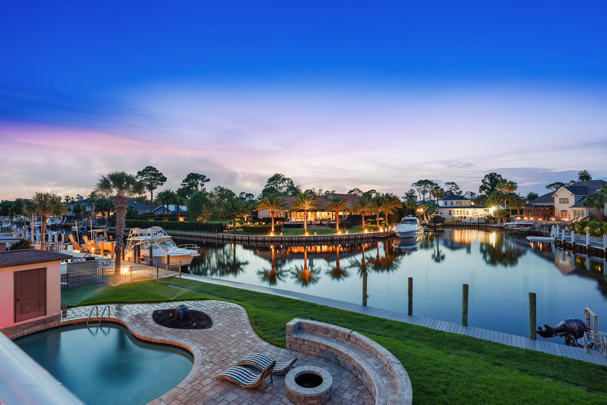 Canal-front living with direct Gulf access defines this exceptional home at 523 Wahoo Road in the gated Bay Point community of Panama City Beach. Set along a wide canal in one of the area's most established marina neighborhoods, this 4-bedroom, 3-bath residence offers approximately 2,820 square feet of thoughtfully designed coastal living with effortless boating convenience.

The main living areas are oriented to showcase tranquil water views, with large windows and easy flow to the outdoor spaces. A spacious, open design connects both living rooms, the dining area, and the kitchen, creating an inviting layout ideal for everyday living and entertaining. Distinctive sunken living rooms add architectural character and warmth, providing comfortable gathering spaces with timeless appeal.

The kitchen features generous counter space, abundant cabinetry, and a functional layout suited for everything from casual mornings to hosting family and guests. The privately situated primary suite captures canal views and offers ample closet space and an en suite bath designed for comfort and privacy. Three additional bedrooms and two full baths provide flexibility for guests, a home office, or additional living space, making this property well suited as either a primary residence or a coastal second home.

Outdoor living is central to the appeal of this canal-front property. With direct access to the Gulf of Mexico, it is ideal for boating, fishing, and exploring the surrounding waterways.