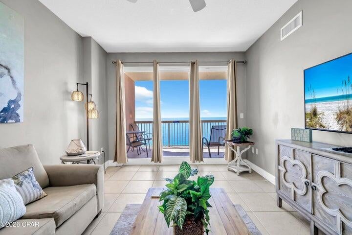 PRIME 24th-Floor Gulf-Front Condo at Sunrise Beach Resort! High above the shoreline, Unit 2408 looks down on the sandbars and turquoise shallows of the Gulf, with wide views of the emerald water and sugar-white sand. Upper floors mean bigger views and more privacy. This 2BR/2BA has a separate bunk room with its own door and a twin-over-full bunk, so it lives like a 3-bedroom. It's sold fully furnished and rental-ready. 9' ceilings and floor-to-ceiling sliding glass doors fill the living area with light. They open to an oversized covered balcony, which you can also reach from the Gulf-front primary suite. The primary bath has a double vanity and garden tub/shower combo, and a second full bath serves the guest areas. Tile and luxury vinyl plank flooring throughout. The kitchen offers granite countertops, GE appliances including a side-by-side refrigerator with ice and water, and a breakfast bar.