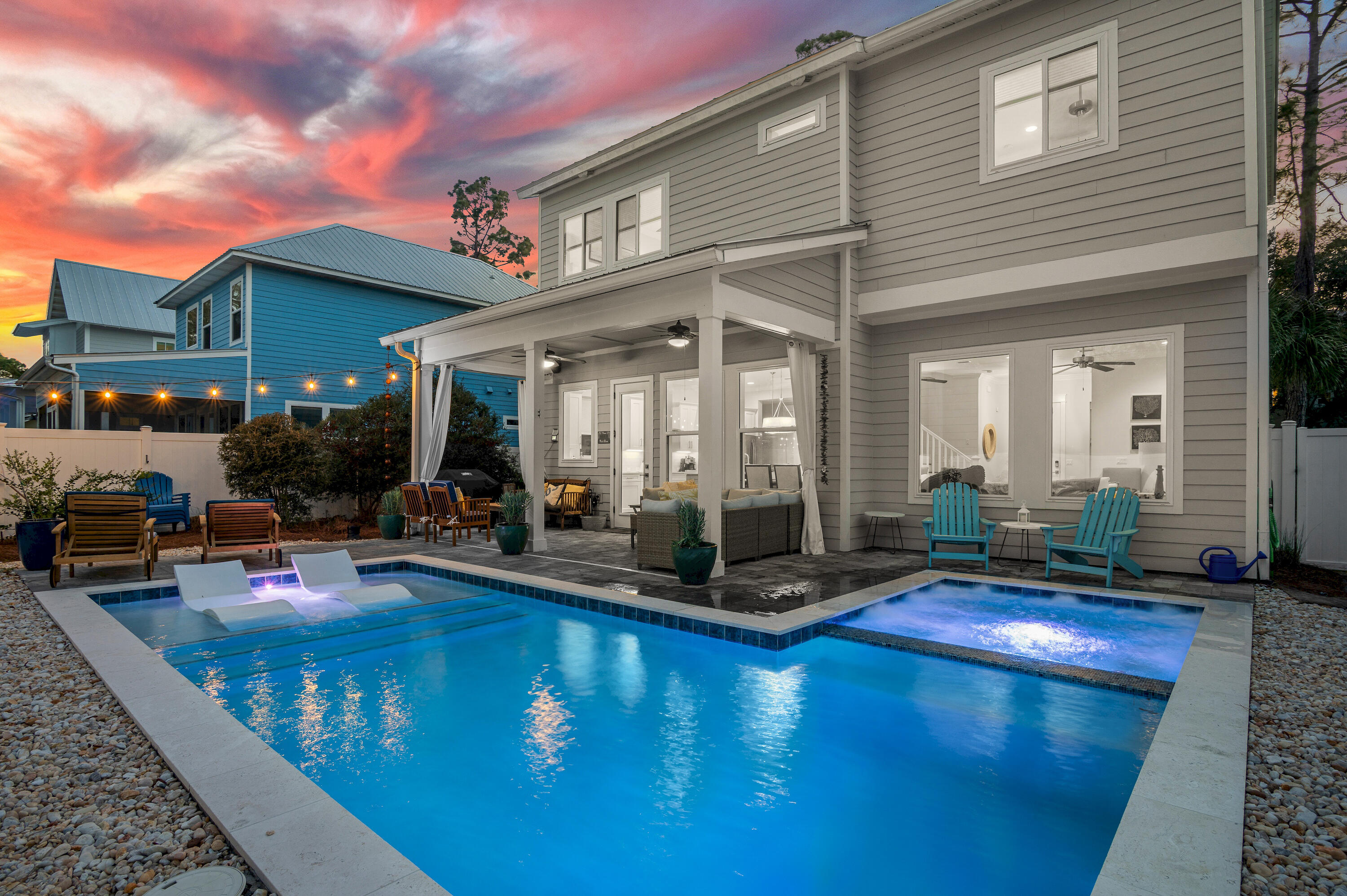 Strong investment opportunity and/or ideal for full or part-time residency. This quality home was built in 2017 and is located in a beautiful, quiet neighborhood. The expansive, rare and fenced 8050sf LOT is centrally located SOUTH of 30A & across the street from one of the area's largest rare coastal dune lakes.  There is a neighborhood park with  a boat launch that provides easy access to Eastern Lake ( kayaks OR motorized boats ) and leads straight to the gulf!  The new expansive, heated pool with sun ledge chairs and jetted hot tub speaks for itself. The tanning ledge is perfect for the days you just want to sun at the pool or enjoy the patio area and/or fire pit area. The yard is professionally landscaped with natural coastal dune foliage and trees that reminds you that you are at the beautiful emerald coast. If you choose, you can take the 3 minute bike ride or golf cart to two flat beach access points. It's a great location that will suit everyone's needs! Golf cart and bikes convey with sale.

As you enter this 4 Bed / 3.5 Bath home you'll be impressed with its abundance of natural light allowed by the entire back wall of high impact rated casement windows. An open concept design and custom upgrades gives it a Modern Coastal feel. The chef's kitchen is a big plus!
