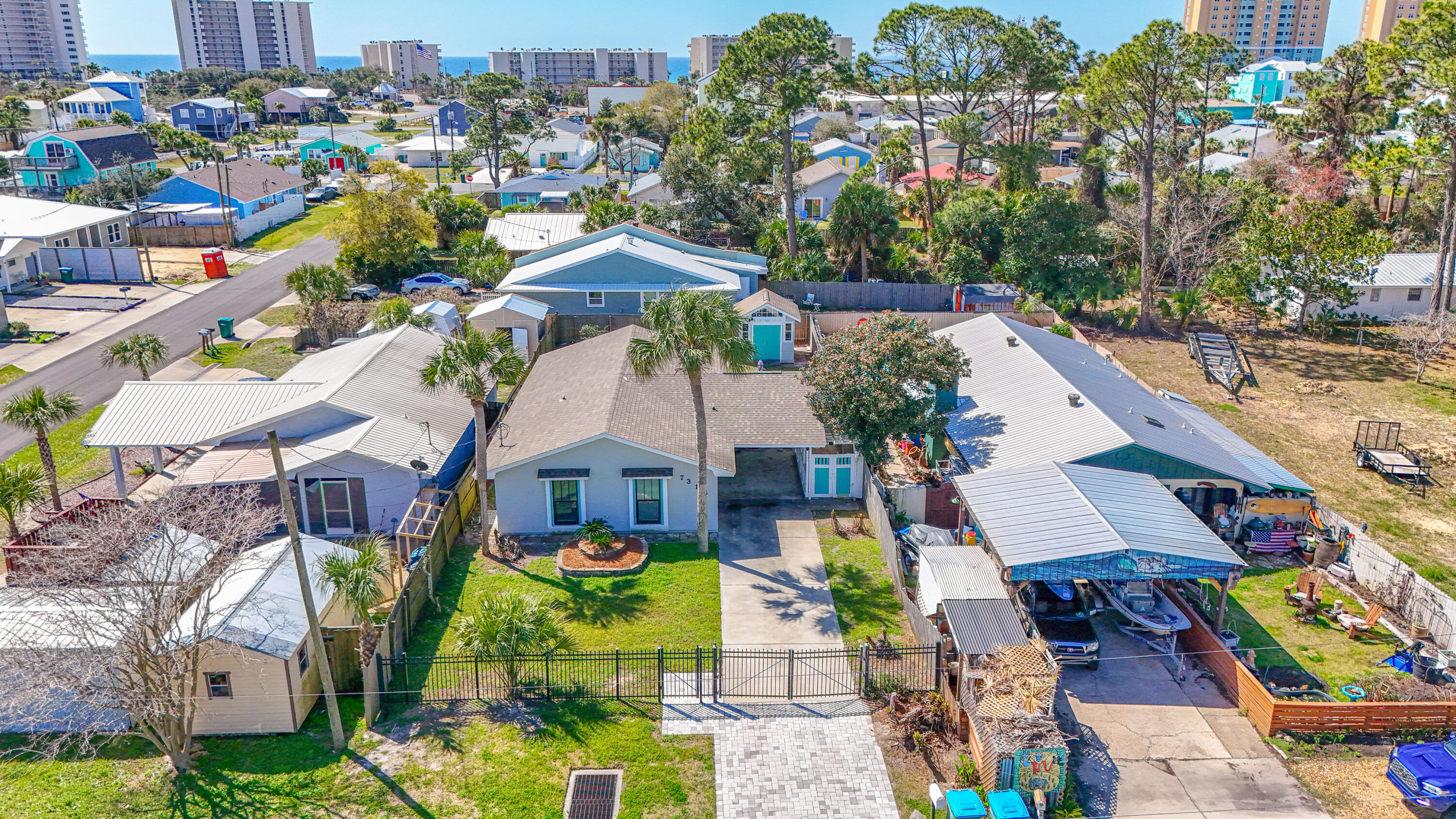 No HOA and short-term rentals permitted!  Located just 3 blocks from the beach and directly across from the lagoon, this beautifully furnished 3 bedroom 2 bath home offers the perfect blend of comfort and convenience.  The features 2 spacious living areas ideal for relaxing or entertaining.  Enjoy outdoor dining and gathers on the large deck, perfect for coast living.  A generous storage building provides plenty of space for beach gear, bikes and lawn equipment.  This well0maintained home is tastefully decorated and move in ready.  The full laundry room, located just off the kitchen, also includes additional storage space for added functionality.  Home has a successful rental history.