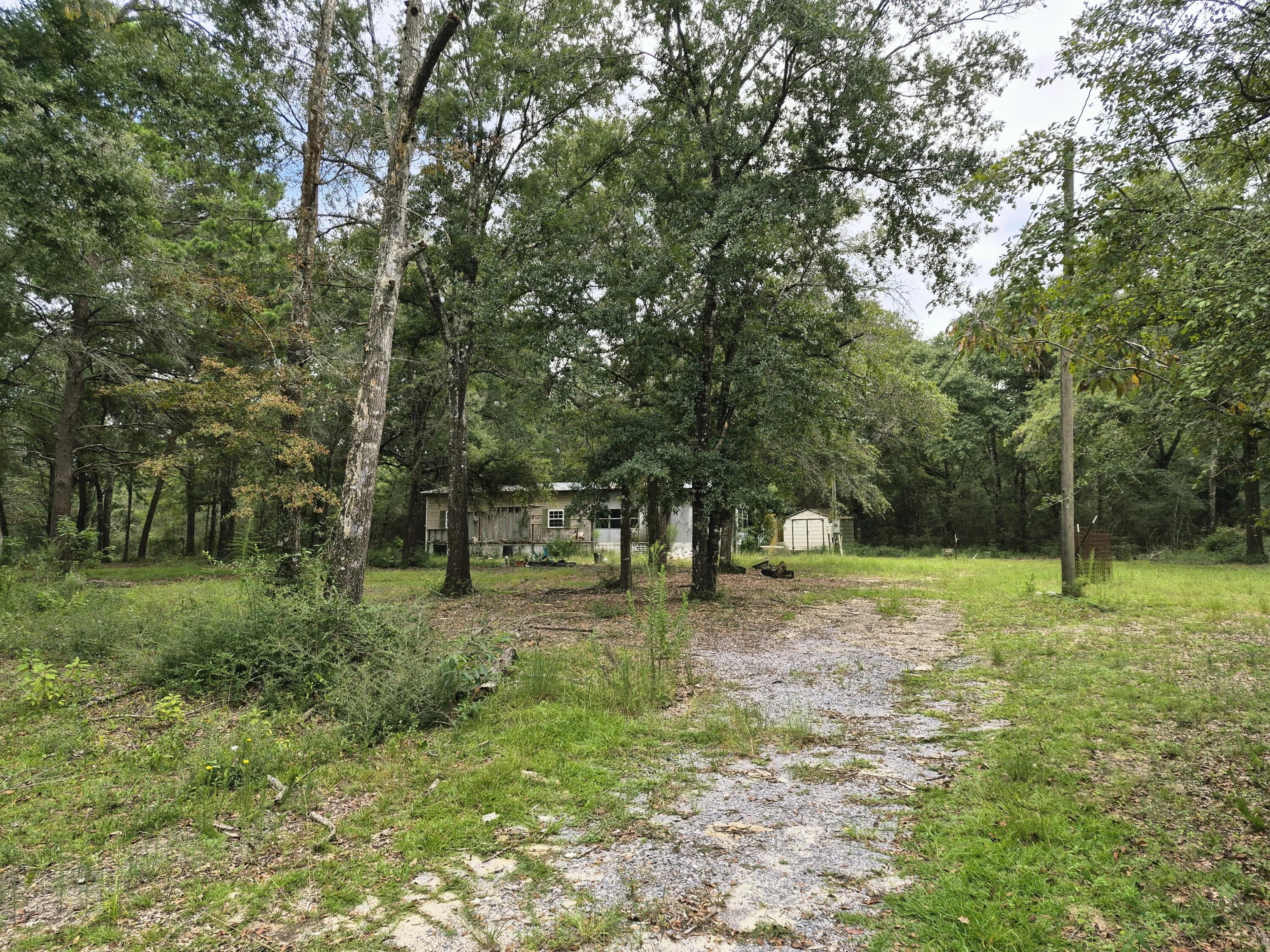 Investors!
Located on a quiet non-outlet road, this property offers privacy and a peaceful setting with minimal through traffic. The property includes a 2-bedroom, 2-bath mobile home, which is being conveyed as-is with no value attributed to the structure. Existing improvements include a septic system and electric service already in place. This property presents an excellent opportunity for future use, investment, replacement home, or redevelopment.
Bring offers!