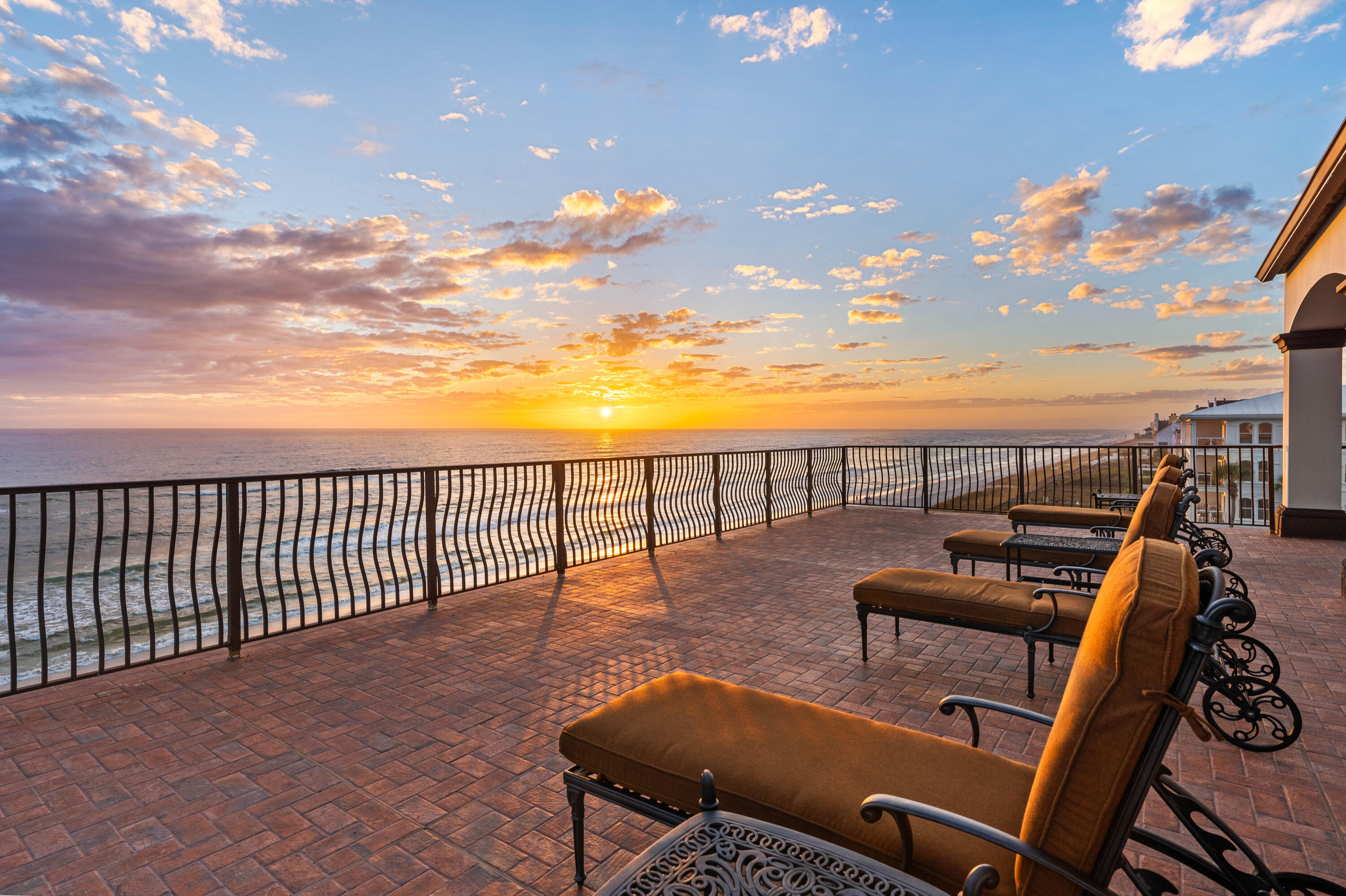 Gulf Front Opportunity on the East End of 30A! Perfectly positioned between the communities of Alys Beach and Rosemary Beach, this luxurious 6 bedroom, 6 full bath and 2 powder bath Gulf Front estate offers an extraordinary beachfront lifestyle within the prestigious, gated community of Santimo Beach, home to just 20 residences. This residence with over 8,000 square feet of living space, an elevator, private pool and spa, and two-car garage combines elegance and privacy with breathtaking Gulf vistas, delivering an ideal setting for those who seek refined living in a truly distinctive setting. Step inside to reveal lavish spaces highlighted by tiled floors, rich wood millwork and doors, plaster walls, custom Wood-Mode cabinetry, luxe tiled bathrooms, designer lighting and much more. The first level includes three spacious guest suites with ensuite bathrooms and a dune side covered porch with heated swimming pool and spa that can be remotely controlled.

On the second level, find the expansive living and dining spaces highlighted by stunning views from a light-filled wall of gulf front, oversized windows. This space features two separate seating areas, one with a cozy stone fireplace plus an elegant dining area flanked by a walk-in 468 bottle wine room. Delighting the most discerning of chefs, the gourmet kitchen offers an oversized breakfast bar, granite counters, a center island constructed of Venus leathered marble, and an extensive suite of commercial grade appliances from Perlick, Scottsman, Viking, and Sub-Zero. Step outside to a covered gulf front balcony spanning the width of the home with direct access to the private beach walkover, newly installed in 2023. The second level also includes a guest suite with ensuite bathroom and a powder room.

An elegant, custom curved staircase leads to the third level which houses the gulf front primary suite bathroom featuring a gas fireplace, sitting area, walk-in his and hers closets, a beverage center, direct access to the gulf front balcony, and a luxe ensuite with double sinks, whirlpool bathtub, and walk-in shower. An office with custom-built bookshelves and a guest suite with ensuite bathroom are also located on this level.

Ascend to the fourth level and find the crown jewel with an amazing 2,000 SF of outdoor space for entertaining including a summer kitchen, oversized dining table and multiple sitting areas. The top terrace includes both covered and open decks to enjoy the exceptional sunset and unobstructed beach views.

This exceptional estate embodies the best of sophisticated beachfront living on 30A. From the newly installed private beach walkover to the latest in smart home technology and premium finishes, every detail has been thoughtfully enhanced to elevate comfort and convenience. Whether enjoying sunsets from the beach or one of the expansive balconies, entertaining in the stunning outdoor spaces, or relaxing by the private pool and spa, this home offers an unparalleled retreat in one of the Gulf Coast's most sought-after communities.