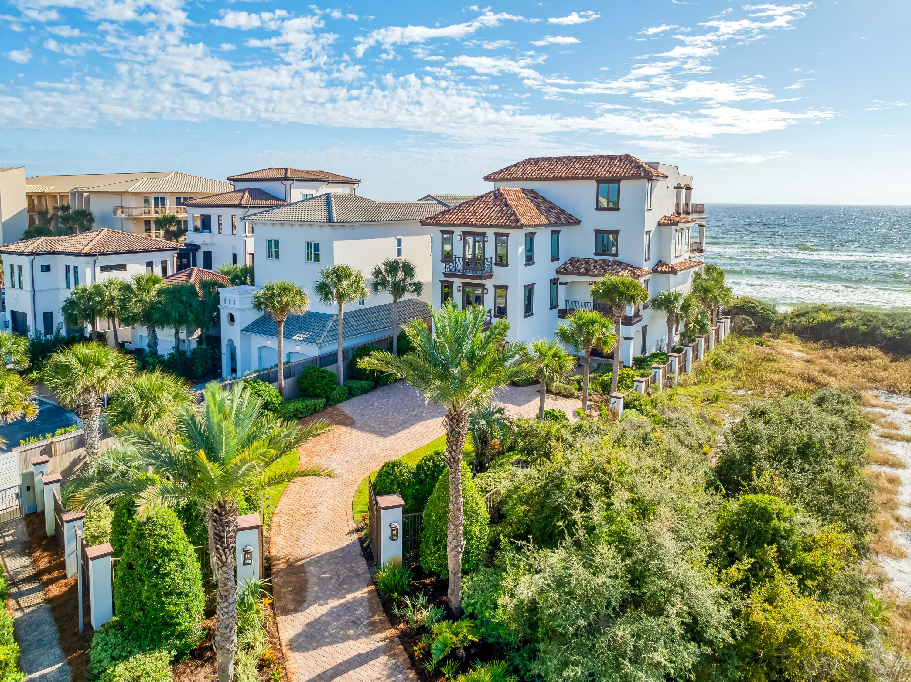 Gulf Front Opportunity on the East End of 30A! Perfectly positioned between the communities of Alys Beach and Rosemary Beach, this luxurious 6 bedroom, 6 full bath and 2 powder bath Gulf Front estate offers an extraordinary beachfront lifestyle within the prestigious, gated community of Santimo Beach, home to just 20 residences. This residence with over 8,000 square feet of living space, an elevator, private pool and spa, and two-car garage combines elegance and privacy with breathtaking Gulf vistas, delivering an ideal setting for those who seek refined living in a truly distinctive setting. Step inside to reveal lavish spaces highlighted by tiled floors, rich wood millwork and doors, plaster walls, custom Wood-Mode cabinetry, luxe tiled bathrooms, designer lighting and much more. The first level includes three spacious guest suites with ensuite bathrooms and a dune side covered porch with heated swimming pool and spa that can be remotely controlled.

On the second level, find the expansive living and dining spaces highlighted by stunning views from a light-filled wall of gulf front, oversized windows. This space features two separate seating areas, one with a cozy stone fireplace plus an elegant dining area flanked by a walk-in 468 bottle wine room. Delighting the most discerning of chefs, the gourmet kitchen offers an oversized breakfast bar, granite counters, a center island constructed of Venus leathered marble, and an extensive suite of commercial grade appliances from Perlick, Scottsman, Viking, and Sub-Zero. Step outside to a covered gulf front balcony spanning the width of the home with direct access to the private beach walkover, newly installed in 2023. The second level also includes a guest suite with ensuite bathroom and a powder room.

An elegant, custom curved staircase leads to the third level which houses the gulf front primary suite bathroom featuring a gas fireplace, sitting area, walk-in his and hers closets, a beverage center, direct access to the gulf front balcony, and a luxe ensuite with double sinks, whirlpool bathtub, and walk-in shower. An office with custom-built bookshelves and a guest suite with ensuite bathroom are also located on this level.

Ascend to the fourth level and find the crown jewel with an amazing 2,000 SF of outdoor space for entertaining including a summer kitchen, oversized dining table and multiple sitting areas. The top terrace includes both covered and open decks to enjoy the exceptional sunset and unobstructed beach views.

This exceptional estate embodies the best of sophisticated beachfront living on 30A. From the newly installed private beach walkover to the latest in smart home technology and premium finishes, every detail has been thoughtfully enhanced to elevate comfort and convenience. Whether enjoying sunsets from the beach or one of the expansive balconies, entertaining in the stunning outdoor spaces, or relaxing by the private pool and spa, this home offers an unparalleled retreat in one of the Gulf Coast's most sought-after communities.