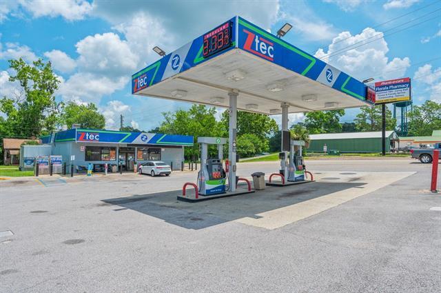 Prime commercial opportunity with this established convenience store sits on nearly an acre along a bustling beach highway at the main intersection to the Gulf Coast. The 3150 sqft building offers incredible versatility for various business ventures in this high-traffic location. Recently upgraded, property features an established deli serving breakfast, lunch, and dinner to loyal local customers. The only 24-hourconvenience store in town, it's already proven its value. The site includes four gas pumps with a 680 square foot canopy, 28,000-gallonsteel tanks installed in 1997, and coolers. Recent improvements include upgraded bathrooms and tile floors. With 7,500 square feet of paved area providing excessive parking, there's room for additional business expansion. Purchase includes lot behind store and alley road, maximizing your investment. If you're looking to continue the established convenience store operation or transform this prime real estate into your own business vision.