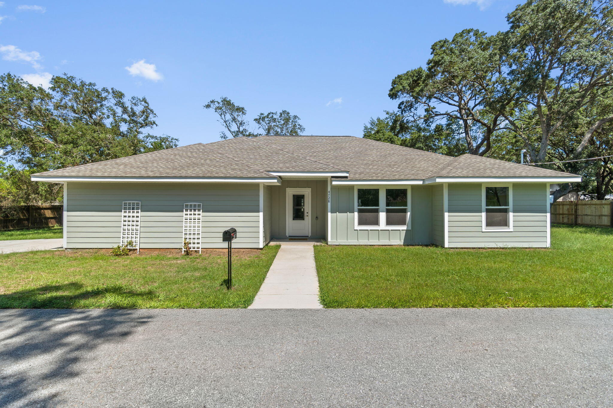 Ask about our preferred lender's lower-rate buydown!
BRAND NEW, MOVE-IN READY, AND NO HOA! Welcome to 4728 Bay Breeze Drive, where modern new construction meets the relaxed Gulf Breeze lifestyle. This beautifully finished home offers 3 bedrooms PLUS a versatile bonus room, 2 full bathrooms, 1,726 square feet, and an attached side-entry 2-car garage. Step inside to an open, light-filled floor plan featuring vaulted ceilings, durable LVP flooring, a spacious kitchen with quartz countertops, large center island, white cabinetry, stainless appliances, and plenty of room for entertaining. The flexible bonus room is perfect for a home office, playroom, guest room, or additional bedroom space. The primary suite features a beautifully tiled walk-in shower with frameless glass and modern finishes. Outside is where this property really separates itself from typical new construction. Step out onto the large covered back patio, perfect for relaxing, grilling, or entertaining while overlooking the large, park-like yard shaded by beautiful mature oak trees. The side-entry 2-car garage adds to the home's attractive curb appeal while providing plenty of parking and storage. With approximately a quarter-acre lot and NO HOA, you'll have room to enjoy your property without the restrictions and fees of an association. Conveniently located in Gulf Breeze with easy access to shopping, dining, schools, and the beautiful Gulf Coast beaches.
If you've been looking for the low-maintenance benefits of new construction without sacrificing yard space, mature trees, covered outdoor living, or flexibility, this is the one. Schedule your showing today!