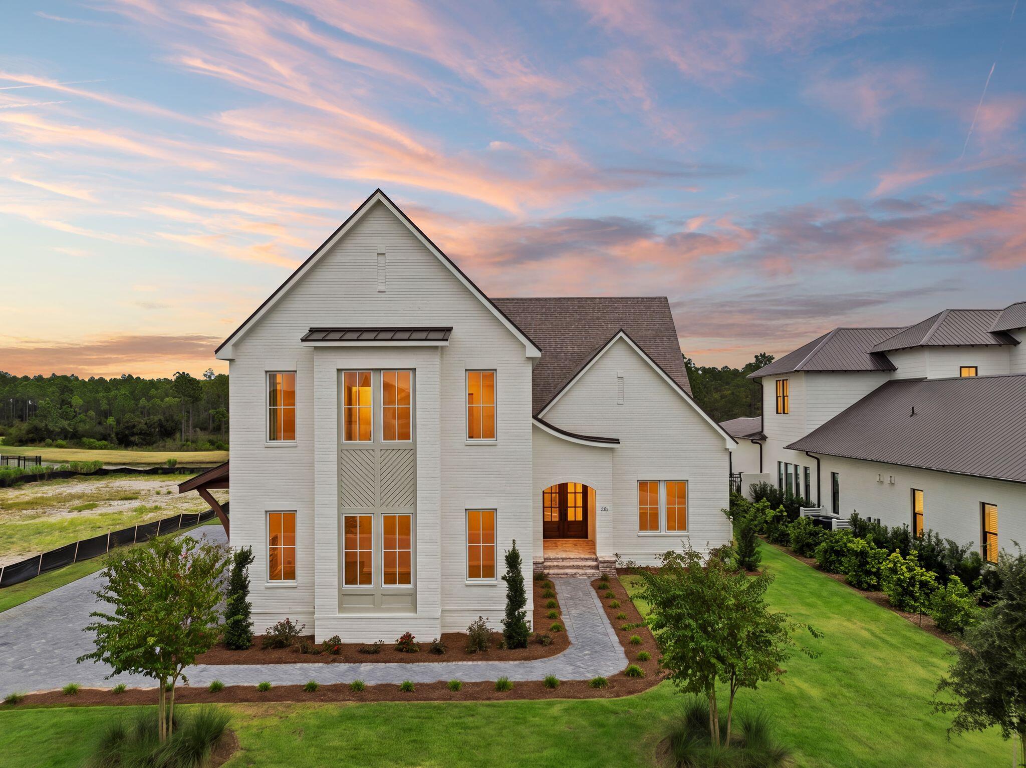Nestled within the exclusive Watersound Camp Creek community, this stunning custom-built residence offers the perfect fusion of luxury, functionality, and coastal elegance. With 5 bedrooms, 4.5 bathrooms, and over 4,000 square feet of thoughtfully designed living space, this home is tailored for both relaxed family living and sophisticated entertaining. Step inside to discover an expansive open-concept floor plan highlighted by soaring 12-foot ceilings in the main living and kitchen areas. The chef's kitchen is a true showpiece, featuring top-of-the-line appliances, custom cabinetry, and an adjoining scullery that makes hosting and everyday prep effortless.

The main level boasts three spacious bedrooms, including a luxurious primary suite complete with a spa-inspired ensuite and a generously sized walk-in closet. Upstairs, you'll find two additional guest bedrooms, a flexible media/lounge space, and a well-appointed kitchenette ideal for extended family, guests, or multi-generational living.

Designed for both comfort and style, the oversized outdoor entertaining area is a standout feature of this home. An elegant outdoor kitchen and fireplace provide the perfect setting for both lively gatherings and quiet relaxation.

Crafted with meticulous attention to detail, every inch of this home is finished with high-end designer touches and premium craftsmanship. Set on a private, forest-backed lot, this property combines the best of community living with serene natural surroundings, all just steps from world-class amenities.

Owners in Watersound Camp Creek enjoy an exclusive level of membership to the St. Joe Company's Watersound Club. This entitles you to direct access to the club amenities at Camp Creek including resort pools, an 11,000 sqft fitness center, tennis and pickleball courts, multiple private dining venues, and Tom Fazio designed golf course. Other member benefits include the Watersound Beach Club amenity center with complimentary gulf-front chair and umbrella service. Members also enjoy golf at the private Shark's Tooth course at Wild Heron and The Third, the clubs newest course.