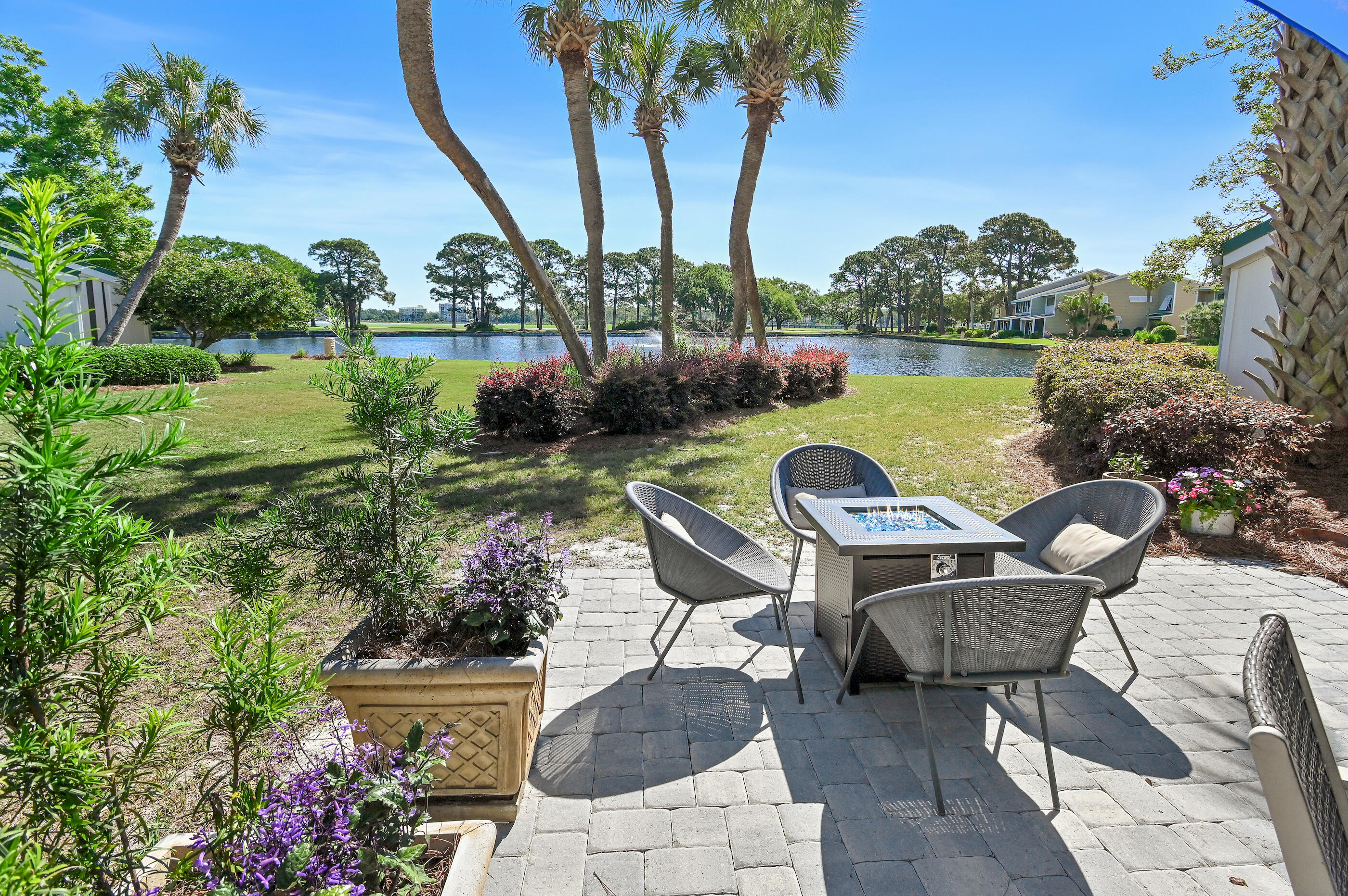 Enjoy stunning panoramic views of the lake, golf course, and marina from this beautifully appointed one-story condo--an exceptional setting that truly exceeds expectations.

Located within the highly sought-after Sandestin resort, this property offers the ultimate in coastal living with access to 7.5 miles of pristine Emerald Coast beaches, multiple golf courses, pools, tennis and pickleball courts, a full-service marina, and an array of shopping and dining options. With an included golf cart, everything is conveniently accessible--no car needed.

Start your mornings with coffee in the sunroom and unwind in the evenings with a glass of wine on the newly installed paver patio featuring a cozy fireplace, all overlooking the serene lake. This property is also an outstanding investment opportunity, with strong short-term rental projections of approximately $60K annually. Sold fully furnished and turnkey, with summer bookings already in place that can transfer to the new owner, it's ready to generate immediate income.

Additional highlights include:

Centrally located in the desirable Bayou Village neighborhood
Single-level layout with expansive water, golf, and marina views
Oversized master closet with potential to convert into a bunk room for added sleeping capacity
Open-concept kitchen with quartz countertops, shiplap accents, open shelving, stainless steel appliances, and generous workspace
Residents enjoy a vibrant yet relaxed lifestyle within a 2,400-acre gated resort spanning from the Gulf to the bay. Miles of scenic walking, biking, and golf cart paths wind through mature live oaks, tranquil lagoons, lakes, and beautifully manicured fairways--connecting you to everything the community has to offer.