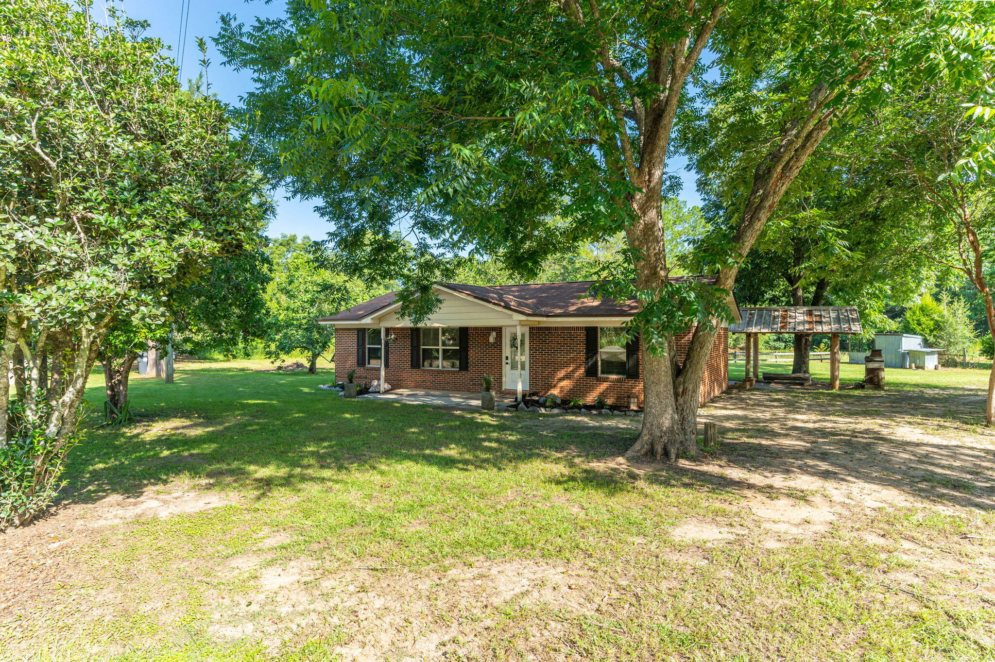 Seller offering up to $7,500 for buyer to use towards interest rate reduction or closing costs. Fish Pond, Fruit Trees, Pecan Trees & more - Beautifully maintained 3 bedroom, 2 bathroom brick home located in the peaceful community of Glendale, Florida. Sale includes 4 LOTS consisting of 2 parcels that could be adjoined under 1 parcel after closing if desired. This property offers the perfect blend of comfort and outdoor living on a spacious property that includes access to a stocked pond (bream & bass), three varieties of producing pecan trees, a pear tree, and a fig tree, The parcel with the home includes 2 lots and there's 2 additional lots included as well. Inside, the home features tile flooring throughout the main living areas and bathrooms, with carpet in all 3 bedrooms. Fresh interior paint, updated windows, wood cabinets, and matching Whirlpool stainless steel appliances give the home a clean, updated feel. Enjoy the outdoors with a custom-built real wood cabana area complete with a concrete pad, rough-cut wood bench, with a TV mount and outdoor fireplace perfect for entertaining. Access easily by county-maintained roadways. Another plus? This property has a private well & septic system to help reduce your monthly utility bills. Don't miss out on this unique property offering comfort and country charm!