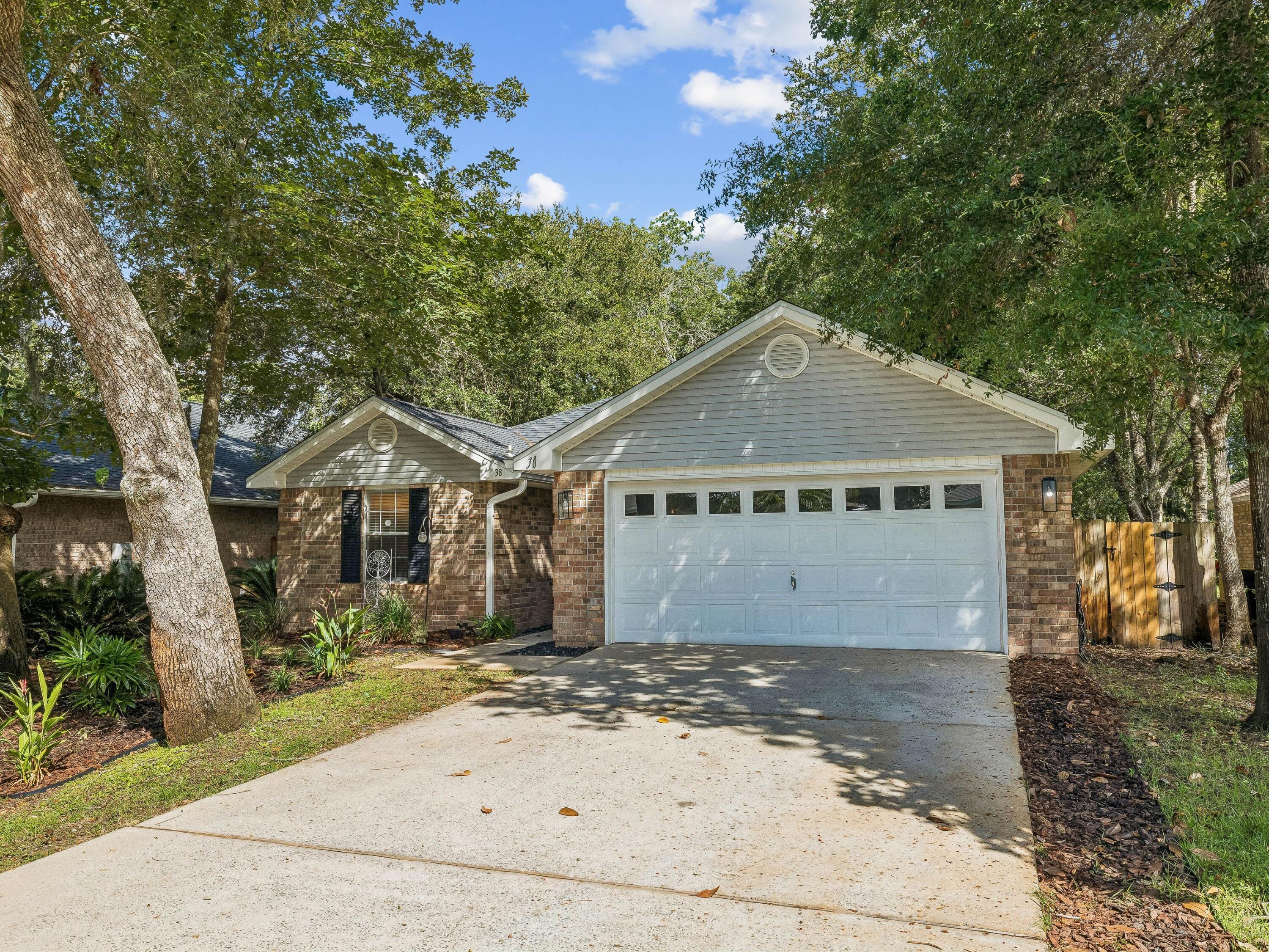 Designed for effortless everyday living, this four-bedroom, two-bath home pairs a bright, open interior with a private backyard offering plenty of room to enjoy the outdoors. With 1,653 square feet arranged entirely on one level, the split floor plan offers comfortable gathering spaces, generous storage and practical finishes throughout.

Vaulted ceilings enhance the sense of space in the main living areas, where commercial-grade luxury vinyl plank flooring creates a cohesive foundation for the open living, dining and kitchen spaces. The updated kitchen features abundant cabinetry and counter space, stainless steel appliances, a pantry and a breakfast bar overlooking the adjoining living and dining area. The open configuration keeps the heart of the home connected while providing plenty of room for meals, entertaining and daily routines.

The split floor plan provides added privacy for the primary suite, which includes a spacious walk-in closet and an ensuite bath with a dual vanity. Three additional bedrooms offer flexibility for family, guests, a home office or hobby space, while a second full bath serves the remainder of the home. A dedicated laundry room with washer and dryer hookups adds practical convenience.

Outside, the fully fenced backyard creates a private extension of the living space. Established landscaping, a screened porch and ample lawn provide room for outdoor dining, entertaining, pets or simply unwinding at the end of the day, with space to add a pool. An attached two-car garage and generous driveway parking further add to the home's functionality.

Set north of Highway 98 and close to Choctawhatchee Bay, the home offers convenient access to both the bayfront lifestyle and the area's everyday essentials. Grand Boulevard, Publix, Sacred Heart Hospital, Silver Sands Premium Outlets and Butler Elementary are all within easy reach, while the white-sand beaches of Miramar Beach and the Scenic Highway 30A corridor are just minutes away. An updated kitchen, single-level living, a split floor plan and a private outdoor setting complete a home well positioned for enjoying both sides of the coastal lifestyle.