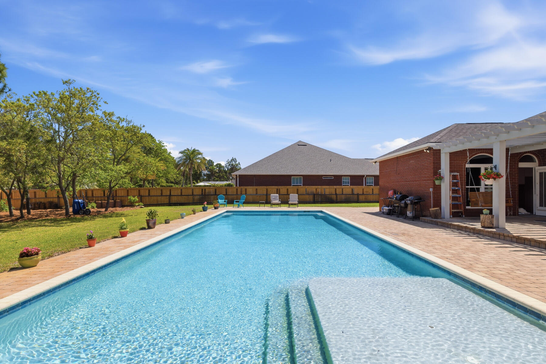Big...Bold...and Beautiful! Big...2923 Sq. Ft. with 4 Bedrooms and 3 Baths, Bold...An Incredibly Large Swimming Pool (1000 Sq. Ft.) situated on a Half Acre Fenced Lot, Beautiful...Inside & Out with very pleasing to the eye landscaping & a great floorplan complete with many recent upgrades! Truly a wonderful home for large families or families visiting their loved ones in one of Florida's most desired destinations. As a very deserving past 'Parade of Homes Award Winner' this home is extemely well built and is in the most favorable zone for insurance. There is a massive amount of storage space adding to an easy lifestyle. If you want a home that allows you to bring the outdoors in & provides more than ample space, then don't delay...come see it today...make it yours...and love it forever!