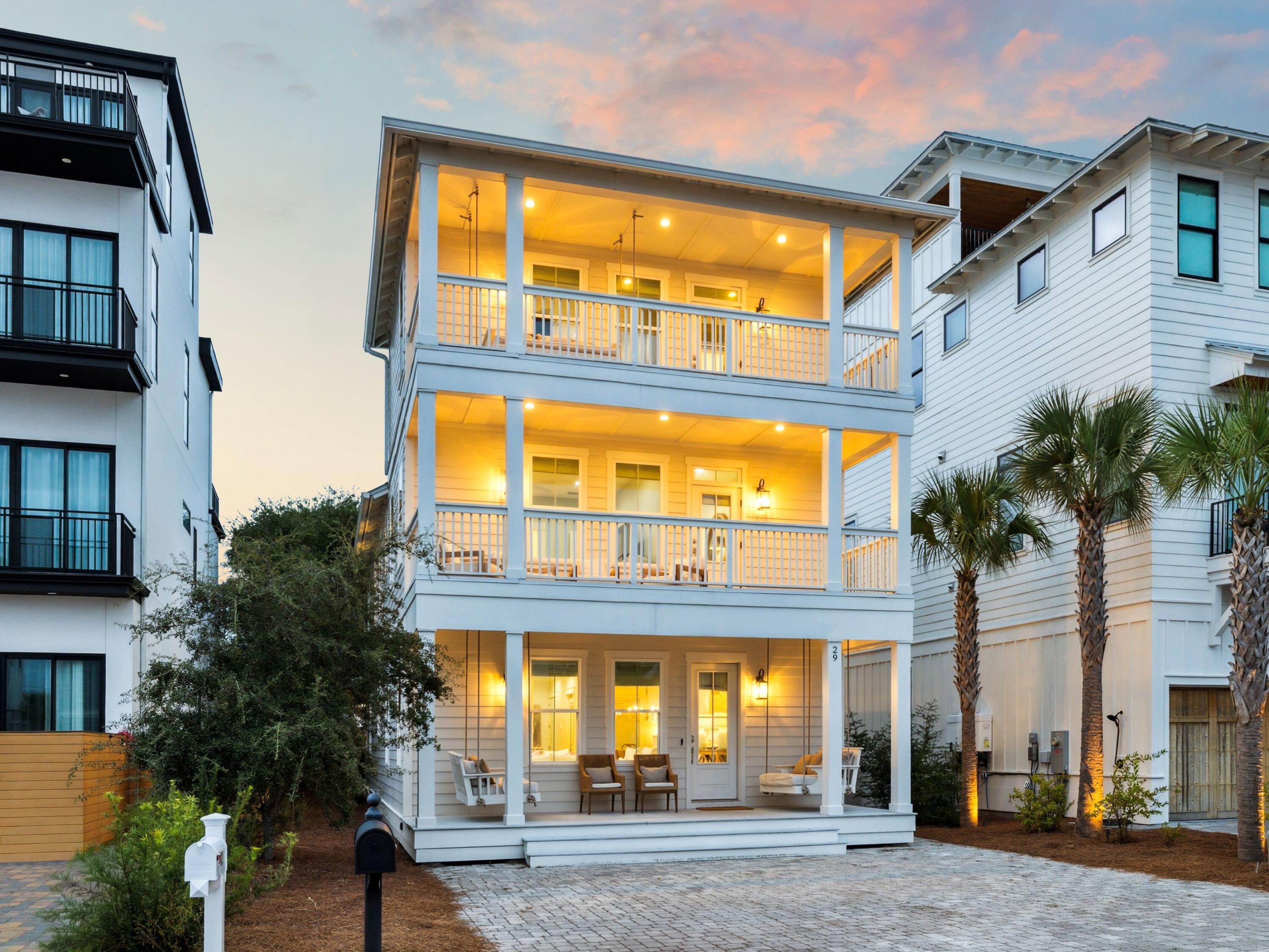 Welcome to this beautifully designed coastal retreat, ideally positioned in the heart of Inlet Beach just south of Highway 98. This three-story, five-bedroom, five-and-a-half-bath home offers the perfect balance of luxury and convenience, with multiple beach access points only steps away and Rosemary Beach, 30Avenue, dining, and boutique shops just minutes from your doorstep. Step inside to an inviting open-concept layout filled with natural light. The main living area features wide-plank luxury vinyl flooring, shiplap accents, and elegant crown molding, creating a refined yet relaxed coastal atmosphere. The chef's kitchen is anchored by an oversized quartz-topped island with seating for five, complemented by custom cabinetry, stainless steel KitchenAid appliances, and stylish lantern lighting. The living and dining spaces flow seamlessly together, making it ideal for entertaining family and friends.
Each bedroom is thoughtfully designed for comfort, with spacious layouts and en suite baths featuring high-end tile and fixtures. The primary suite, located on the first floor, provides a serene retreat with a luxurious bathroom showcasing double vanities, a walk-in shower, and elegant finishes. Upstairs, additional guest suites offer privacy and flexibility, while the third-floor bonus room provides extra space for a bunk area, media room, or additional sleeping quarters.

Multiple decks on every level invite you to enjoy the coastal breeze, and with no HOA, there's the opportunity to add a private pool and create a backyard oasis tailored to your vision. This home is move-in ready for use as a primary residence, second home, or a strong investment property.