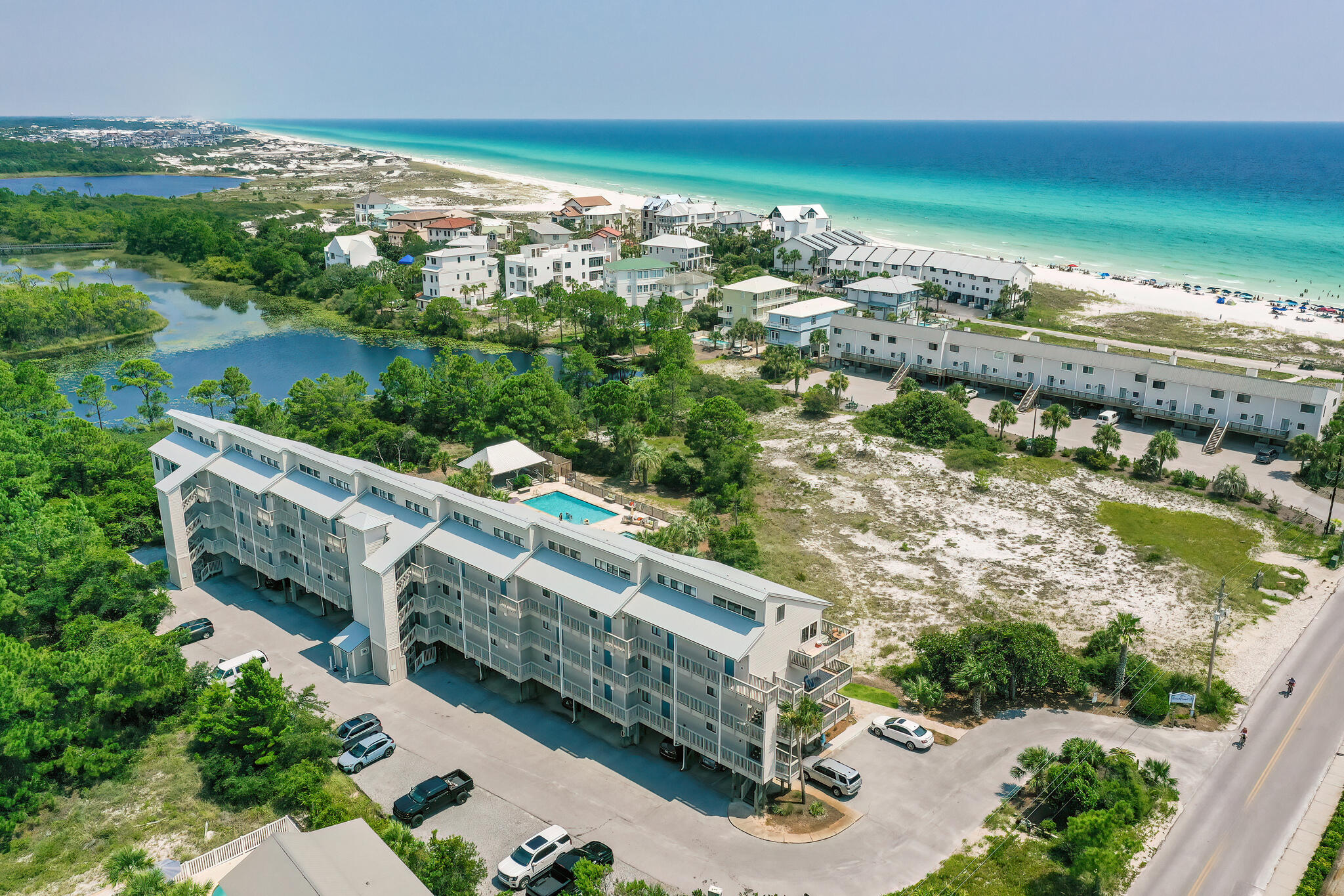 'SEASIDE SERENITY', A 'GULF & LAKE VIEW', 4TH FLOOR CONDO, SOUTH OF 30A! Beachfront II Condos is located just 1/2 Block from the Sugar White Sands and Emerald Green Waters of the Beautiful Gulf of Mexico!!! TOTALLY REMODELED & MOVE IN READY!!! Enjoy your morning coffee while listening to the waves crash on the shore or let them put you to sleep at night! This Condo is Located on the Third floor and overlooking the Brand-New Pool, Hot Tub and a Large Gazebo. There is 2 years rental revenue history in addition to having the next 5 months of almost totally booked gross revenue of $14,000 that can be assumed by the buyer. From the moment you walk in you will notice the 30-foot vaulted ceilings and TOTALLY OPEN FLOOR PLAN.