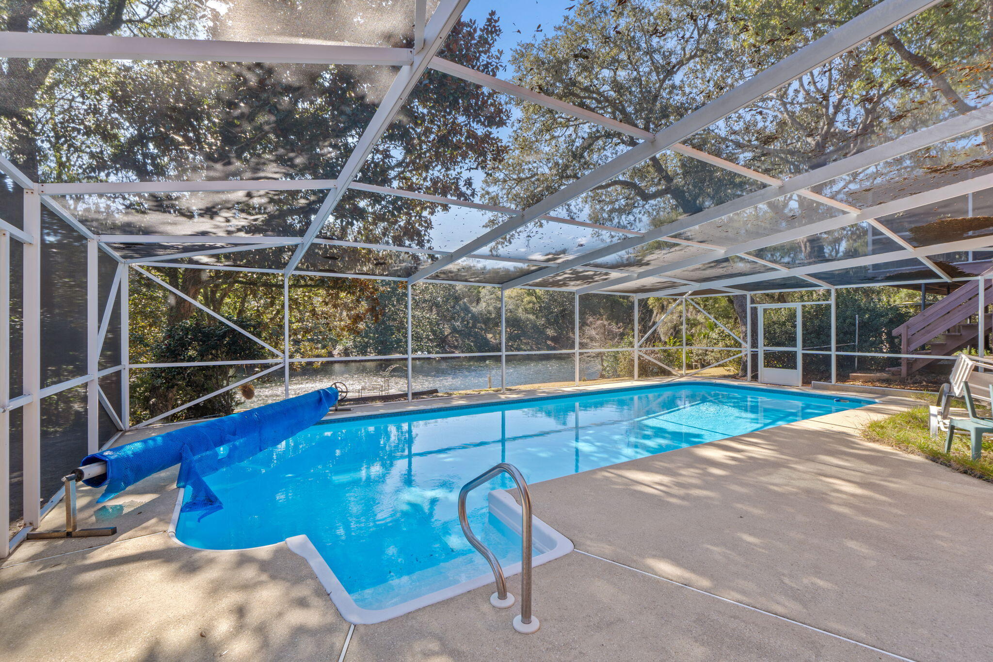 Lakefront living at its best in Kenwood Estates! Star/t your mornings on the screened-in porch, taking in serene views of Bass Lake and the surrounding natural beauty. According to the County Appraiser, the home features 3 bedrooms and 3 full bathrooms, complemented by versatile flex rooms downstairs and a spacious family room that opens seamlessly to the pool—ideal for entertaining or relaxing with family and friends.Step outside to enjoy the in-ground pool with screen enclosure and the large backyard. The basement includes a dedicated workroom, offering excellent space for hobbies, projects, and storage. Additional highlights include a Generac whole-home generator and an EV/RV outlet in the garage, providing both peace of mind and convenience. Ideally located in Fort Walton Beach, just minutes from schools, shopping, dining, Eglin AFB, the airport, and the area's beautiful beaches, this lakefront retreat offers exceptional space, flexibility, and comfort. Don't miss this opportunityschedule your showing today.