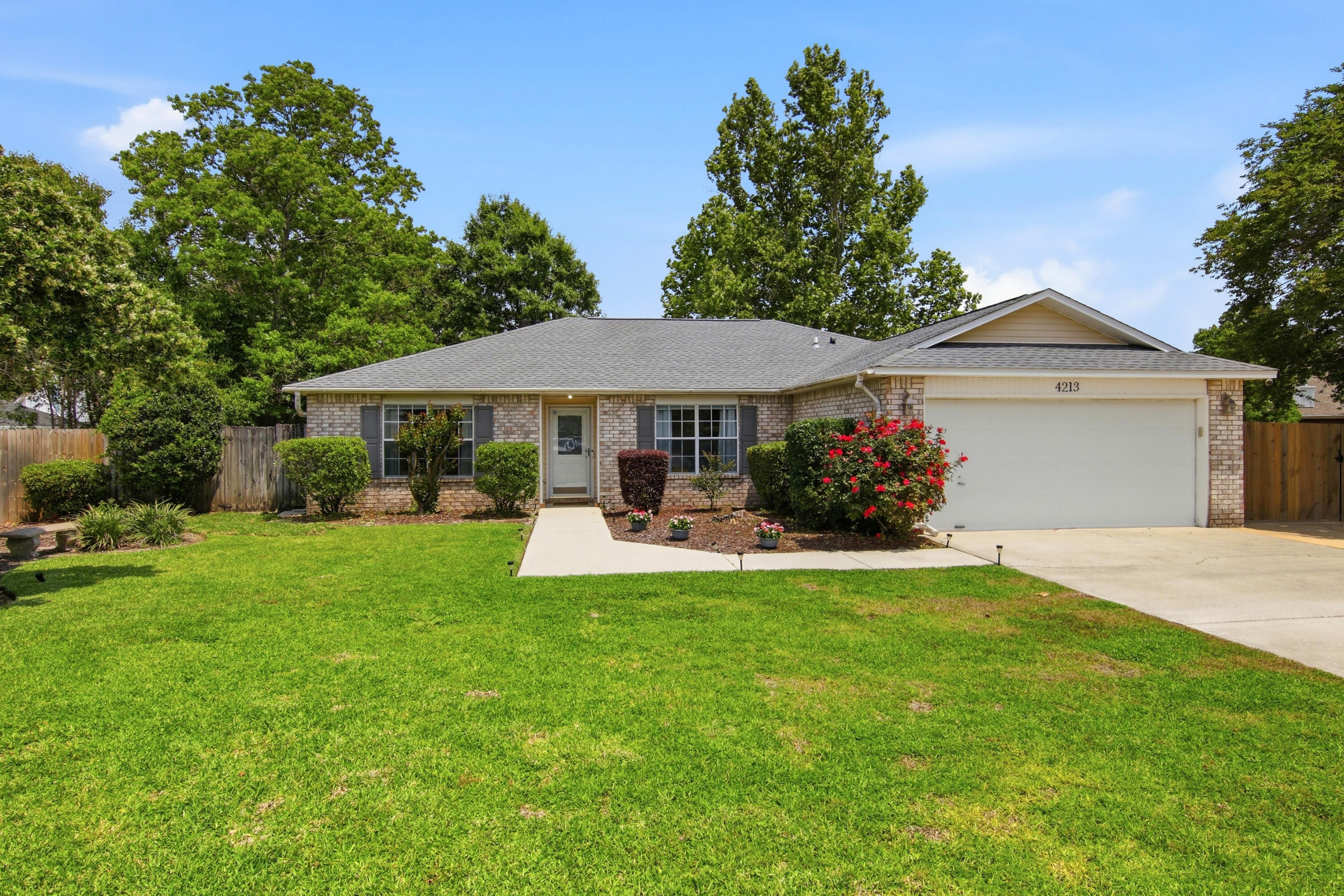 Assumable loan available to VA eligible buyer 4.7% rate.Located on a quiet cul-de-sac in Bluewater Bay, this four-bedroom, two-bath brick home offers a functional split floor plan and comfortable living spaces. Interior features include laminate and tile flooring throughout, crown molding, a cathedral ceiling in the living area, and a fireplace. The Florida Room provides flexible bonus space ideal for a home office, playroom, or additional living area. A standout feature of this property is the reinforced parking pad designed for up to a 40-foot RV or boat, complete with 30- and 50-amp electrical hookups, water, and a sewer dump station.
Roof replaced in December 2022, HVAC 2018 and HWH 2018.