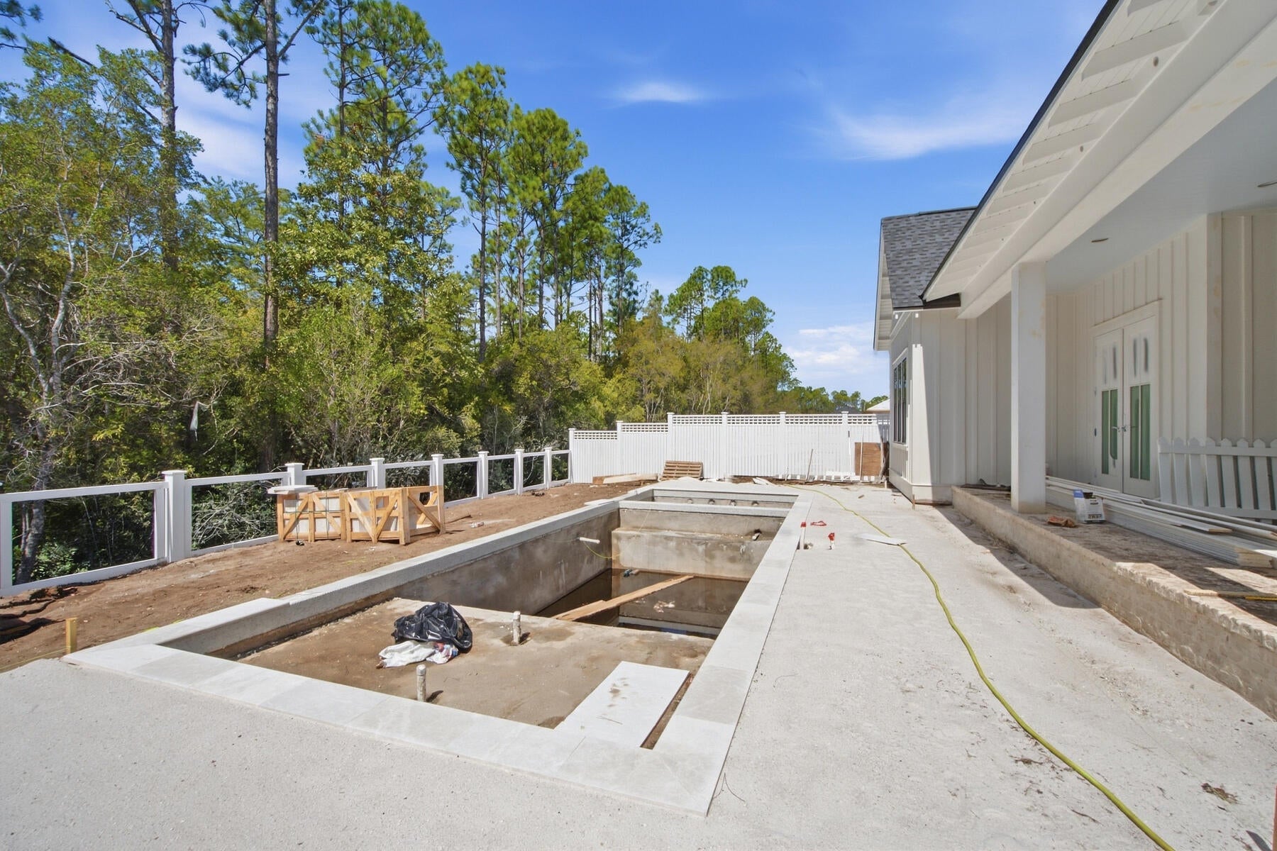 With an estimated completion for late September '26, the Hampton plan in the Preserve Collection at Arborview Park offers a single-level layout with a split-bedroom design, a central living area that connects directly to the outdoor living space and an expanded 3-car garage.

The main living area brings together the kitchen, dining, and living spaces with direct access to the rear screened porch and gorgeous 10'x30' saltwater pool with spa, through 12'x8' slider doors, creating a functional extension of the home for daily use and entertaining. 

The kitchen is designed with a large white oak island, full overlay cabinetry with upper stacked glass display cabinets, upgraded quartz countertops, under-cabinet lighting, and a complete appliance package including a Wolf dual fuel 36'' range, Wolf built-in microwave drawer, custom wood hood vent, Cove dishwasher, and an upgraded 84" tall Sub Zero refrigerator. A butler's pantry and walk-in pantry add additional storage and prep space.

The primary suite is positioned separately from the secondary bedrooms and with en-suite bathroom that includes a custom walk-in closet with framed full size mirror, a dual vanity, walk-in tiled shower, quartz C surfaces, and upgraded plumbing fixtures. Secondary bedrooms are located on the opposite side of the home with access to full bathrooms. A study near the foyer provides a dedicated workspace or flex room.

Upgrades throughout the home include wide plank Medallion engineered wood flooring throughout, Limestone tile flooring in all bathrooms and upgraded herring bone tile floor in laundry room, solid core Shaker doors, cabinetry with soft-close drawers, quartz C countertops throughout, and a brick lay backsplash. Additional features include pre-wiring for speakers in the living room, kitchen, primary bedroom, and rear porch, CAT6 wiring, a tankless water heater, and a gas stub for a future grill .

The 3-car garage provides additional storage and functionality, with access positioned to maintain separation from the main living spaces.