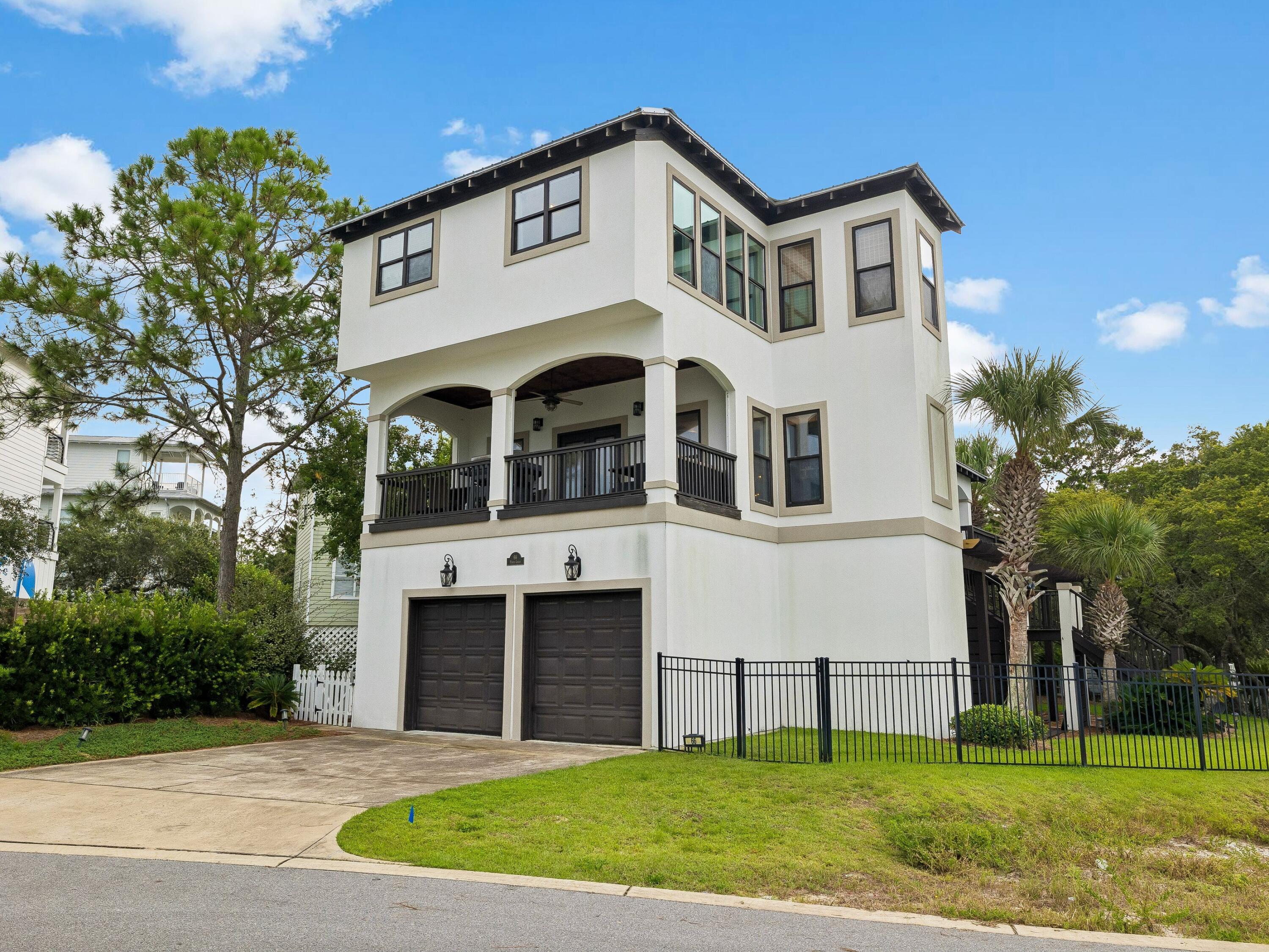 Offering a relaxed coastal setting just moments from the beach, this four-bedroom, three-and-a-half-bath home offers an inviting opportunity for full-time living, a second home, or a coastal getaway with several beach access points nearby. Set within the gated community of Calypso Pointe, the residence pairs a bright, open layout with comfortable indoor and outdoor spaces designed for easy everyday living.

Hardwood floors extend through the home, while a wood-burning fireplace creates a warm focal point in the main living area. Built-in bookcases add character and useful storage, and the open connection between the living room and kitchen lets natural light flow through the shared spaces. Multiple decks extend the living areas outdoors, offering additional places to relax and enjoy the coastal surroundings.

Four bedrooms and three-and-a-half baths provide flexibility for owners and guests, while an attached two-car garage adds valuable storage and parking. Two driveways provide additional space for guest vehicles, an especially convenient feature when entertaining.

Residents of Calypso Pointe also enjoy access to a community swimming pool, along with the privacy of a gated setting. With the beach nearby and dining, shopping, recreation and other area attractions within easy reach, this home offers an appealing combination of space, convenience and proximity to the coast.
