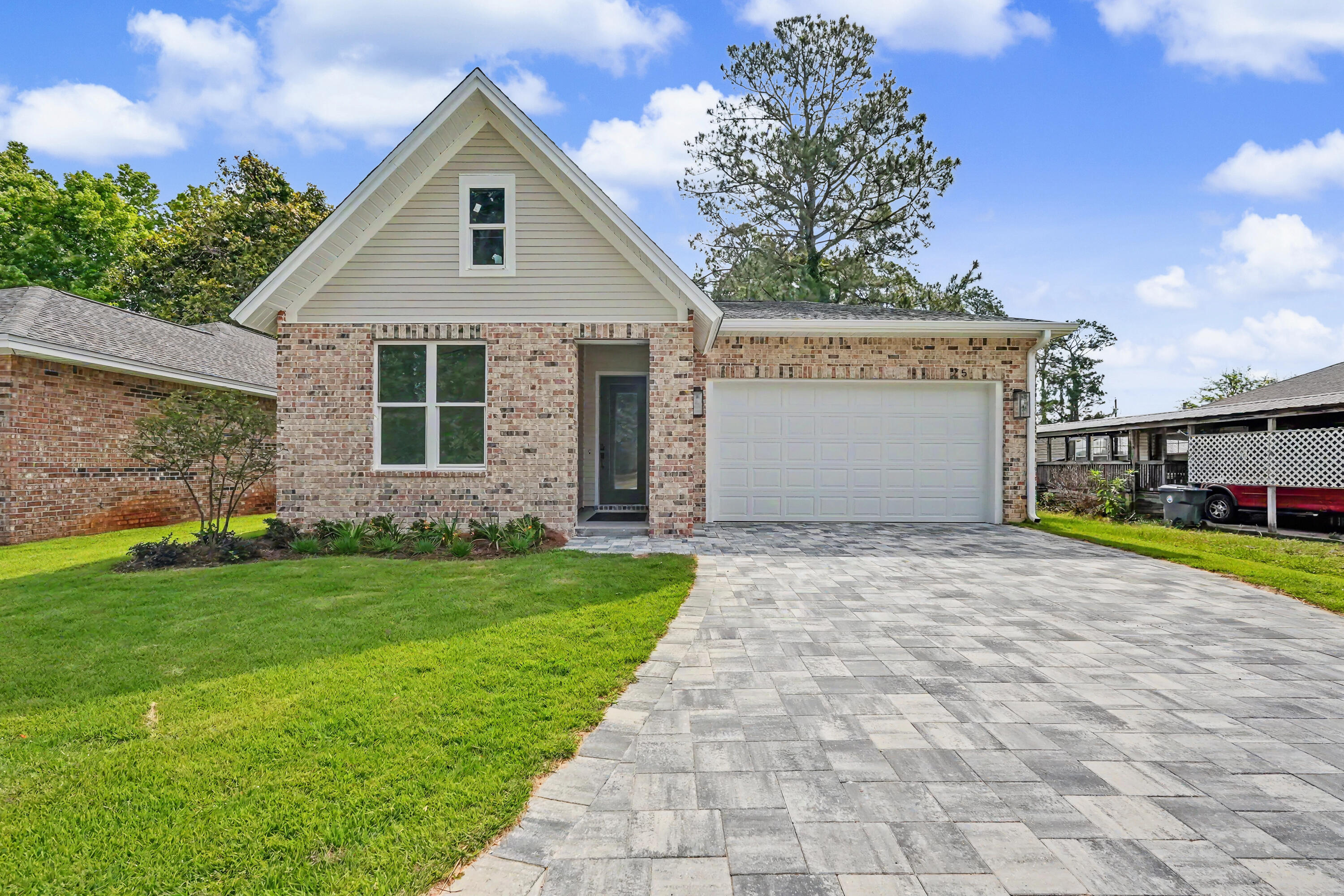 Gorgeous brand-new construction offering a thoughtfully designed split floor plan, high-end finishes, and exceptional functionality throughout. This home features a two-car garage with attic storage above and an upgraded paver extended driveway for added convenience and curb appeal.

Upon entry, you're welcomed by a wide hallway, soaring ten-foot ceilings, and beautiful French oak luxury vinyl plank flooring that flows seamlessly throughout the home. The spacious living area is filled with natural light and complemented by upgraded lighting fixtures, creating a warm and inviting atmosphere ideal for both relaxing and entertaining.

The kitchen is a true centerpiece, featuring stylish two-tone cabinetry, Cashmere Taj quartz countertops, a large island, a walk-in pantry, and ample space for gathering and everyday living. The private primary suite is tucked away at the back of the home, offering peaceful views of the fully fenced backyard. The ensuite bath is beautifully appointed with custom designer tile, Miami white quartz countertops, a large walk-in shower, dual vanities, and a separate water closet.

Secondary bedrooms are located off the front hallway, providing privacy for guests or family, with one bedroom featuring a walk-in closet. The guest bathroom includes a tiled surround bathtub and shower combination with upgraded finishes.

Just off the garage, you'll find a convenient landing zone complete with custom built-ins and hooks--perfect for keeping everyday essentials organized.

With its modern design, quality craftsmanship, and desirable layout, this move-in-ready home is the perfect blend of comfort and style.