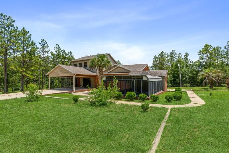 39 ACRES!!  The possibilities are endless....a WEDDING VENUE, a lodge, a place to restore or store classic cars??  What would you use it for???  This property has more than meets the eye! This property (2 parcels) has several buildings, including an almost 2600 sq ft of unique living area. A majestic brick and iron gateway welcomes you upon entering the driveway, which opens into a cleared 4-acre retreat filled with many trees. The property features the home, a screened-in patio perfect for entertaining, a new 6-person hot tub, a detached 1-car garage with a greenhouse room, an 80'x35' ENCLOSED pole barn, and a spring fed stream and pond.  Inside the home you will find the large master bedroom downstairs.  The open kitchen/living area is great for entertaining.  2 nice sized bedrooms and a bathroom are on the 2nd floor (with a bonus area).  The possibilities are endless. Call today for a showing.