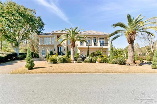 Tucked inside a private gated enclave in the heart of Gulf Breeze, 2 Colley Cove delivers an extraordinary blend of coastal elegance, innovation, and lifestyle. Just minutes from the Gulf of America, top-rated schools, premier shopping and dining, and the sugar-white beaches of Pensacola Beach, this home offers the rare balance of privacy and convenience buyers are searching for.
Designed for both grand entertaining and effortless everyday living, the thoughtfully crafted floor plan showcases soaring ceilings, abundant natural light, and warm coastal tones throughout. Travertine natural stone floors, decorative black iron railings framing beautiful wood staircases, surround sound, and luxurious finishes create a refined yet inviting atmosphere.