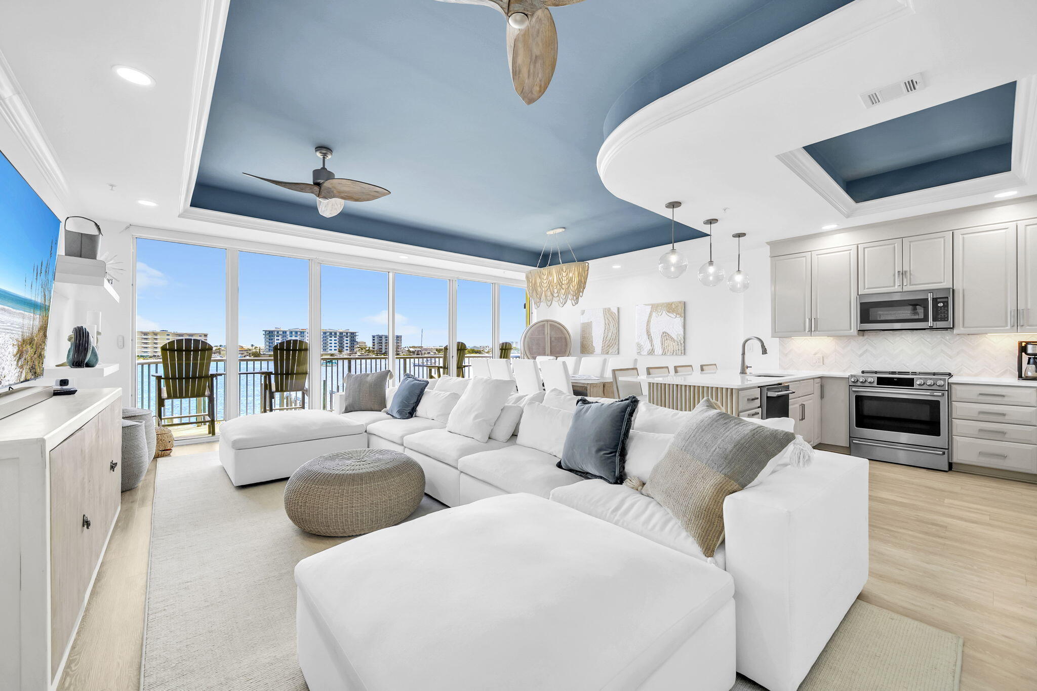 #202 Destin HarborPlace could be THE MOST BEAUTIFUL waterfront unit on the Destin Harbor! Stunning panoramic views from this 2br/2.5ba w/bunk room condo. Luxuriously remodeled & decorated in fresh crisp coastal whites w/teal accents. Relaxed waterfront living in the heart of downtown sold semi-furnished. Floor to ceiling glass doors/windows for amazing vistas of the Destin harbor front that run the entire width of the living/dining area. Beautiful kitchen/dining area w/breakfast bar. Soaring 10' trayed ceilings give an open airy feeling. This is the lifestyle you dream of with the views you'll admire from almost every room. Unique 2 story modern plan: Lg. waterfront 2nd fl MBR suite w/private balcony-gorgeous sunsets, passing yachts, paddleboards -the harbor life! Huge waterfront MBa w/jet tub & walk-in shower. 4 Twin bunk area w/privacy door. Stunning Parisian inspired GBR w/gold chandelier, Juliet balcony & darling ensuite bath w/custom tiling. Only 12 Exclusive residences in this low density, rental restricted private condo w/coded entry; coded access to fitness and pool area w/baths. Includes #202 private storage cage in basement level to store all your personal beach, fishing and golf equipment. Head up to the central rooftop community terrace for viewing fireworks or simply relaxing. Walk or catch the water taxi to many of Destin's favorite harborfront restaurants nearby.  202 Destin Harbor Place- 1 of a kind luxury condo perfect for permanent or 2nd home living! more. Rental restricted condo- no short term rentals allowed; 12mo. leases only. Outdoor parking 2 spaces undesignated; Coded access to building, unit, basement amenities including workout room, bathrooms, private designated owner storage cage, paddleboard storage and launch; boat dock (no slip conveys); Rooftop terrace in center is for community and perfect for watching fireworks, boat parades, or just the twinkling harbor lights. Harbor Place architecture reminiscent of Miami's South Beach area.  So much to enjoy! Easy Show!