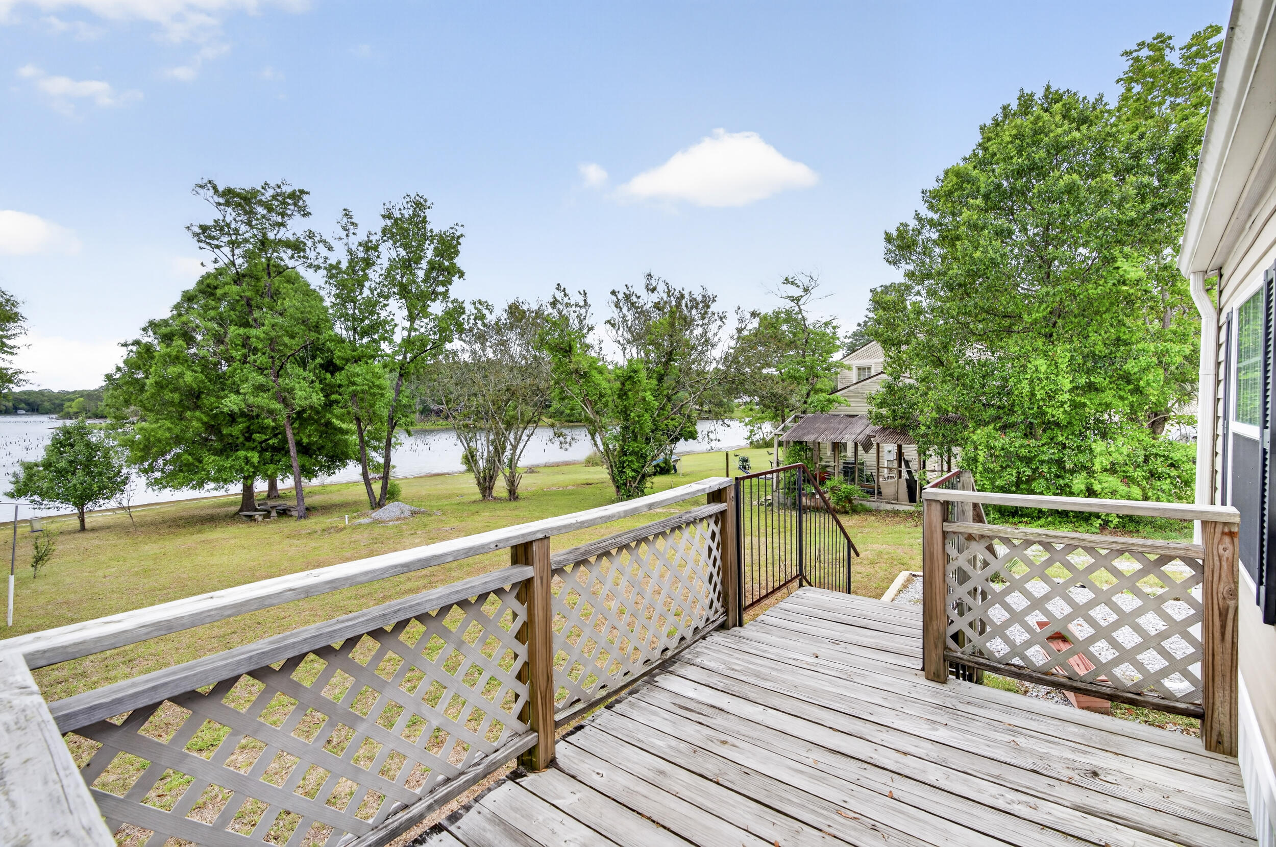 Charming 2-bedroom, 2-bath lakefront home with detached garage/shop and carport situated on a full acre! Enjoy stunning sunset views over the water from your private dock. Don't miss out--call today!
