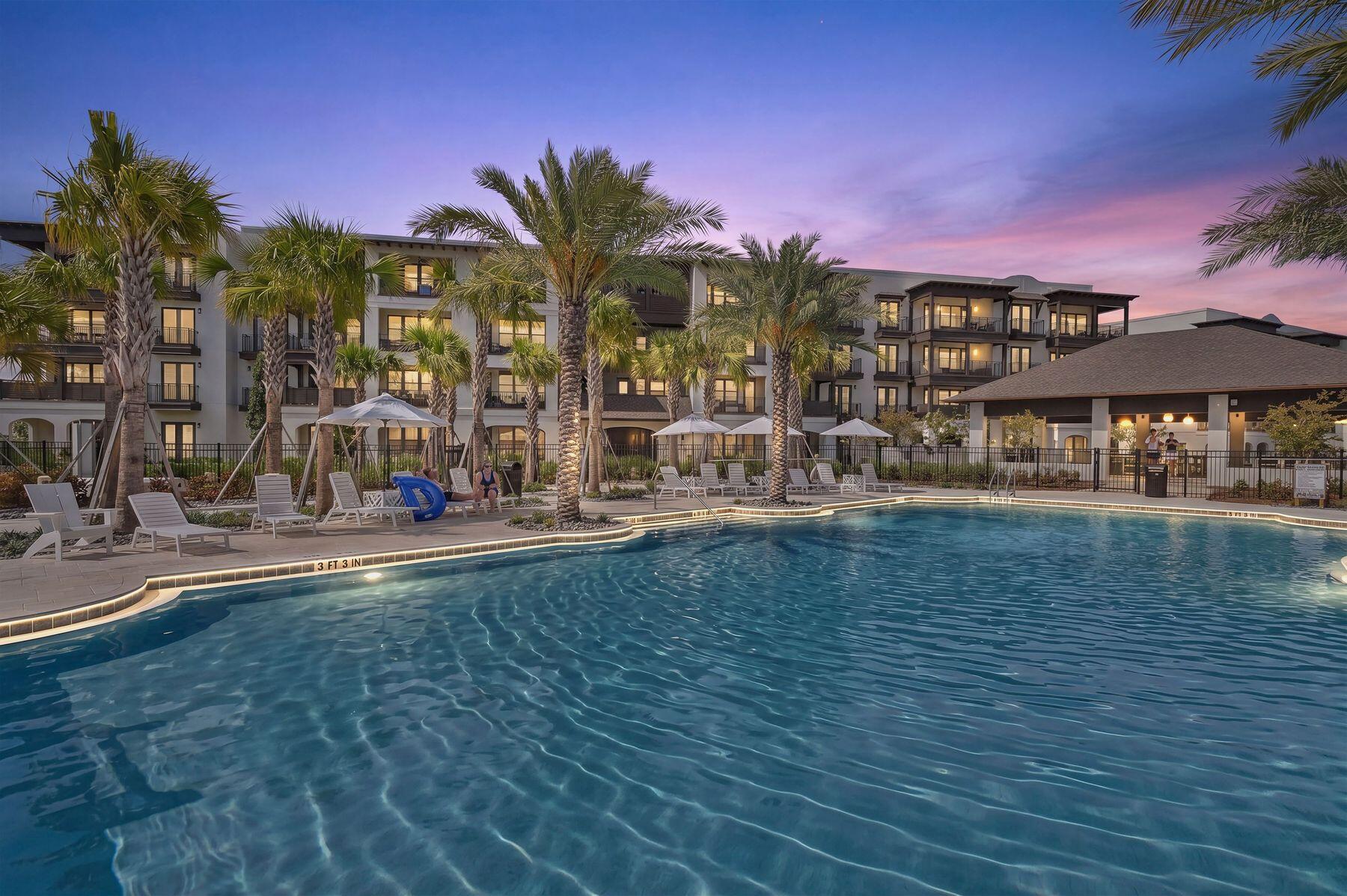 Positioned above the sparkling Aquatic Garden amenities, this exceptional top floor corner residence at The Grove at Seascape offers an elevated resort lifestyle in one of Miramar Beach's newest luxury condominium communities. Thoughtfully designed for both personal enjoyment and exceptional rental potential, this beautifully appointed three-bedroom, three-and-a-half-bath residence pairs sophisticated interiors with an unmatched collection of resort amenities, all within the celebrated Seascape Golf, Beach & Tennis Resort. 

The spacious floor plan comfortably accommodates up to 12 guests, making it equally suited for family vacations or entertaining. The primary suite and second guest bedroom each feature king-sized accommodations with private en suite baths, while the third bedroom offers custom bunk beds and its own private bath. A sleeper sofa in the open-concept living area provides additional sleeping space, while expansive windows and the private balcony frame beautiful views of the lagoon pool, lazy river and lush aquatic gardens below. 

Life at The Grove centers around its spectacular Aquatic Garden, where residents enjoy a resort-caliber collection of amenities including a relaxing lazy river, lagoon-style pool, zero-entry family pool, expansive sun decks, poolside lounge areas and open-air barbecue grills, and expansive outdoor covered dining area with 2 sided gas fireplace. Centralized elevators and trash chutes on every floor add convenience to everyday living, while professional on-site housekeeping and maintenance services provide exceptional ease of ownership. 

Ownership also includes access to the remarkable amenities throughout the 300-acre Seascape Golf, Beach & Tennis Resort. More than 2,000 feet of deeded sugar-white beach frontage provide effortless days along the gulf, complemented by available food and beverage service directly to the beach. Residents also enjoy five community pools, including three seasonally heated pools, an 18-hole championship golf course, tennis and pickleball courts, basketball courts, playgrounds, picnic areas, on-site dining and entertainment, golf cart and bicycle rentals and convenient access to Seascape Towne Center. 

Ideally situated in the heart of Miramar Beach, The Grove also places residents just minutes from Silver Sands Premium Outlets, Grand Boulevard, Scenic Highway 30A and Destin's celebrated collection of restaurants, marinas and entertainment. Whether spending the day on the beach, enjoying championship golf, exploring nearby coastal communities or taking advantage of boating, fishing and year-round events, the very best of the Emerald Coast is always within easy reach. 

Whether envisioned as a primary residence, vacation retreat or investment opportunity, this luxury corner residence offers the rare opportunity to enjoy an amenity-rich coastal lifestyle in one of the Emerald Coast's premier resort destinations.