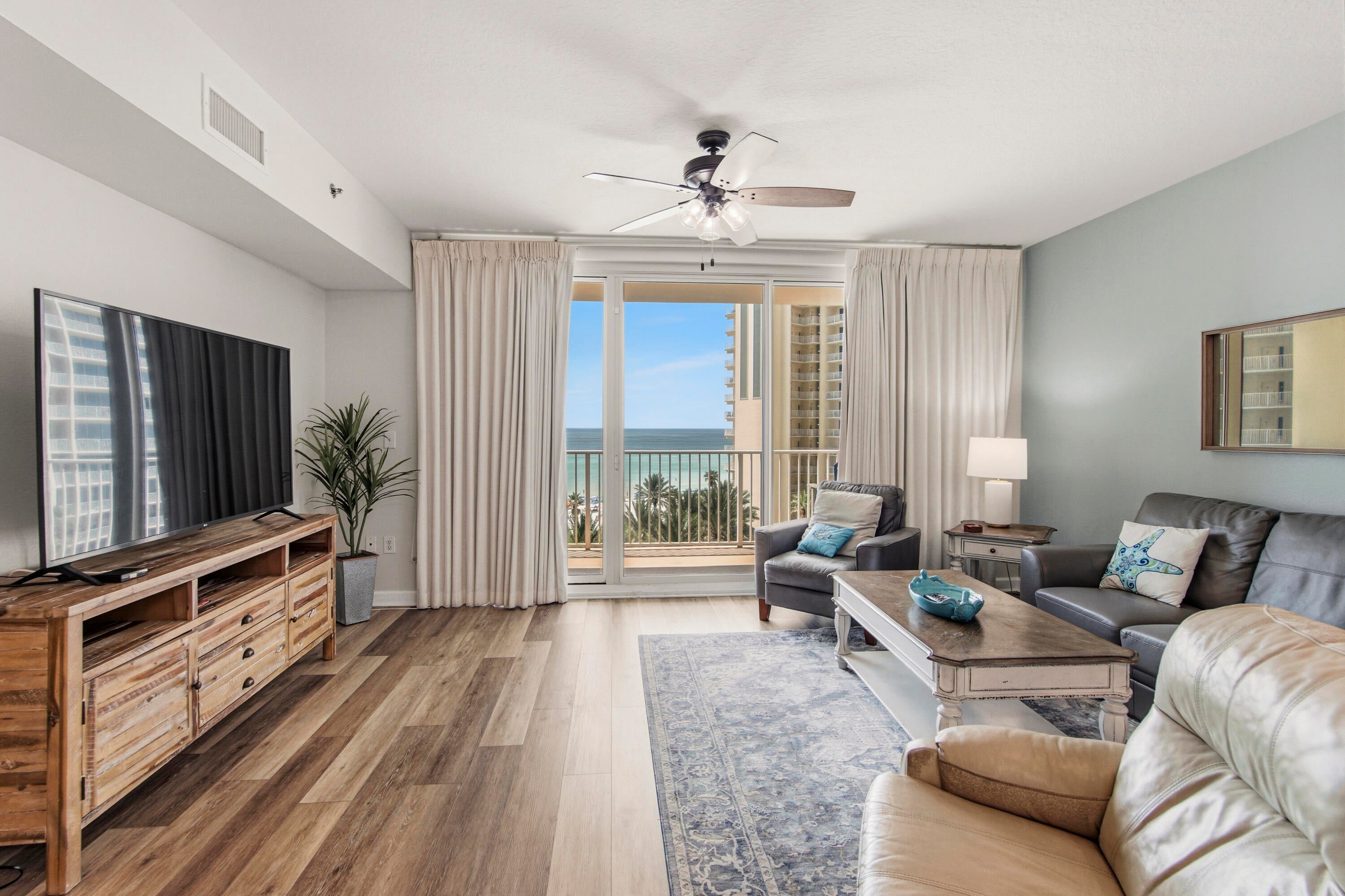 GULF VIEWS + SAME-FLOOR DEEDED PARKING + MILESTONE ASSESSMENTS PAID IN FULL! This is the Shores of Panama condo you need to see! Unit 719 offers 1,184 sq. ft. with 2 bedrooms, a separate bunk area and 3 full baths, plus a beautiful centered view overlooking the lagoon-style pool, white-sand beach and emerald waters of the Gulf of Mexico. Your deeded parking space is on the 7th floor, the SAME floor as the condo! Park and walk directly to your unit without waiting on an elevator with luggage, groceries or beach gear. Inside, the open kitchen, dining and living area keeps that gorgeous Gulf view front and center and leads right out to your private balcony. All patio furniture is included. Looking for an STR investment? Future bookings are already on the books from November through January, and additional bookings made prior to closing can transfer to the new owner. Shores of Panama offers a huge Gulf-front lagoon-style pool, tropical pool deck and direct beach access, all in the heart of PCB near dining, entertainment and attractions. Whether you're looking for a beach getaway, second home or STR investment, Unit 719 checks the boxes. Come see the view for yourself!