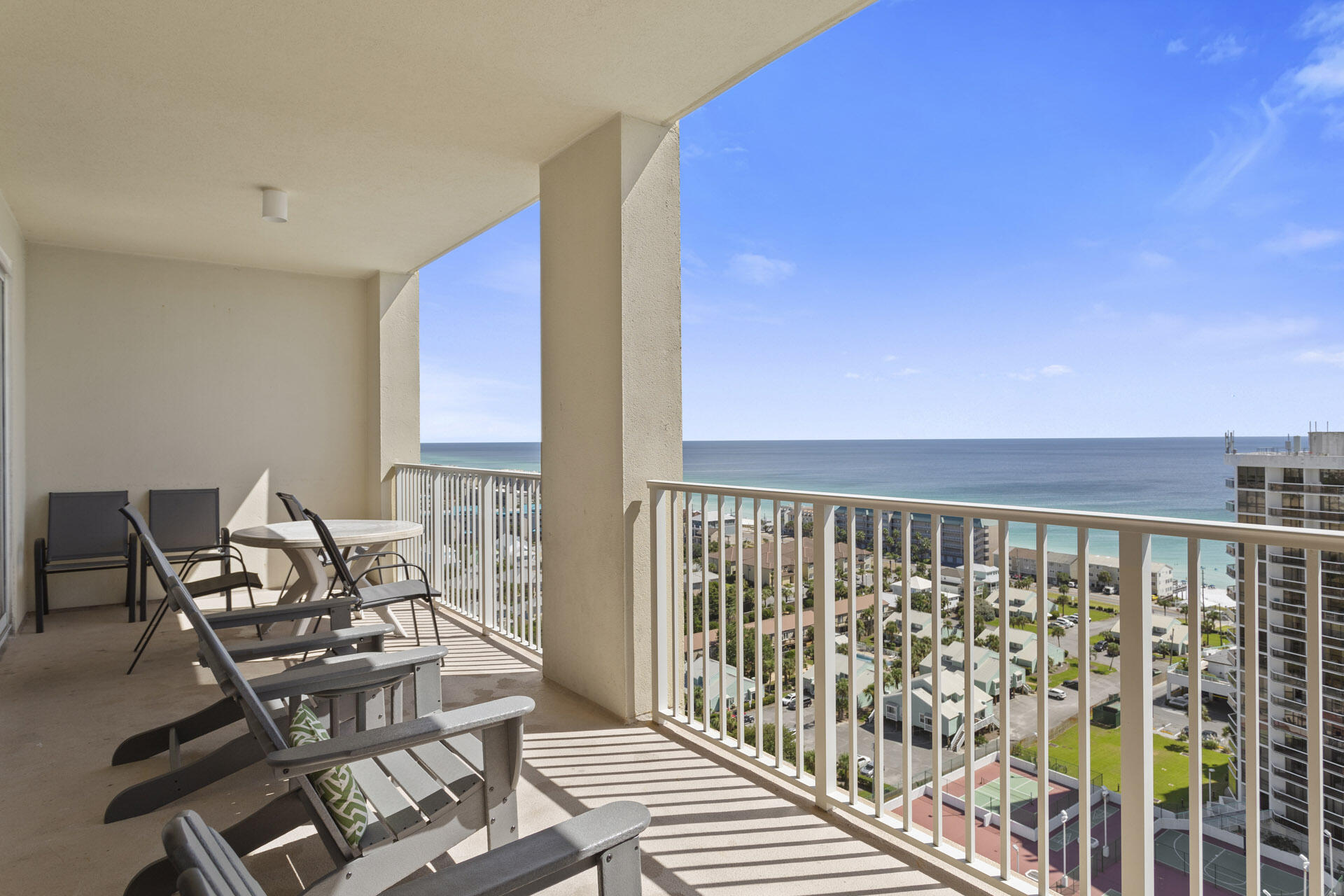 Ariel Dunes I is one of two twin high-rise luxury towers that have a distinctively urbane and sophisticated look. However instead of being located in Miami, they are set in the heart of Destin's Miramar Beach. Ariel Dunes I faces a palm lined boulevard that serves as the entrance to the Seascape Resort and is about 200 yards away from the famous white sand beach. A pedestrian boardwalk extends 2,000 linear feet across the resort and overlooks the jeweled waters of the glistening gulf. Ariel Dunes has two pools that wrap around the base of the building creating a mirage of sorts since when you first see them the building appears to float magically above the water.

Ariel Dunes 1802 towers high above the sensational scenery with a falcon's eye view of the sparkling pool below and the gulf beyond. A large balcony with chairs and a table allow you to relish these views while snacking on tasty seafood appetizers and sipping on your favorite tropical drink. These views may also be seen from within since a set of glass doors provides views of this splendor and immediate access to the breezy balcony. This two bedroom two bathroom vacation rental has a laid back beach feel with silk plants that create a subtle tropical motif. Oversized tile flooring flows throughout creating a spacious look.  You can enjoy the championship golf and tennis the resort has to offer.  Call for more details today.
