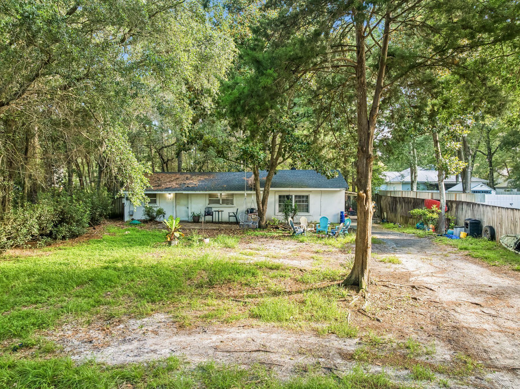 Rare opportunity to own a beautiful, private 0.25-acre homesite in the highly sought-after Daughettes area of Point Washington. Surrounded by soaring oak, magnolia, and cypress trees, this exceptional property offers a peaceful, natural setting that is increasingly difficult to find. An existing block-constructed home conveys at no value, though it features a new roof. Tap fees have already been paid, adding value for future plans. Ideally located just minutes from Choctawhatchee Bay, Tom's Landing Marina, community docks, and the white-sand beaches of Grayton Beach, this is the perfect location to build your dream home or investment property in one of the area's most desirable neighborhoods.