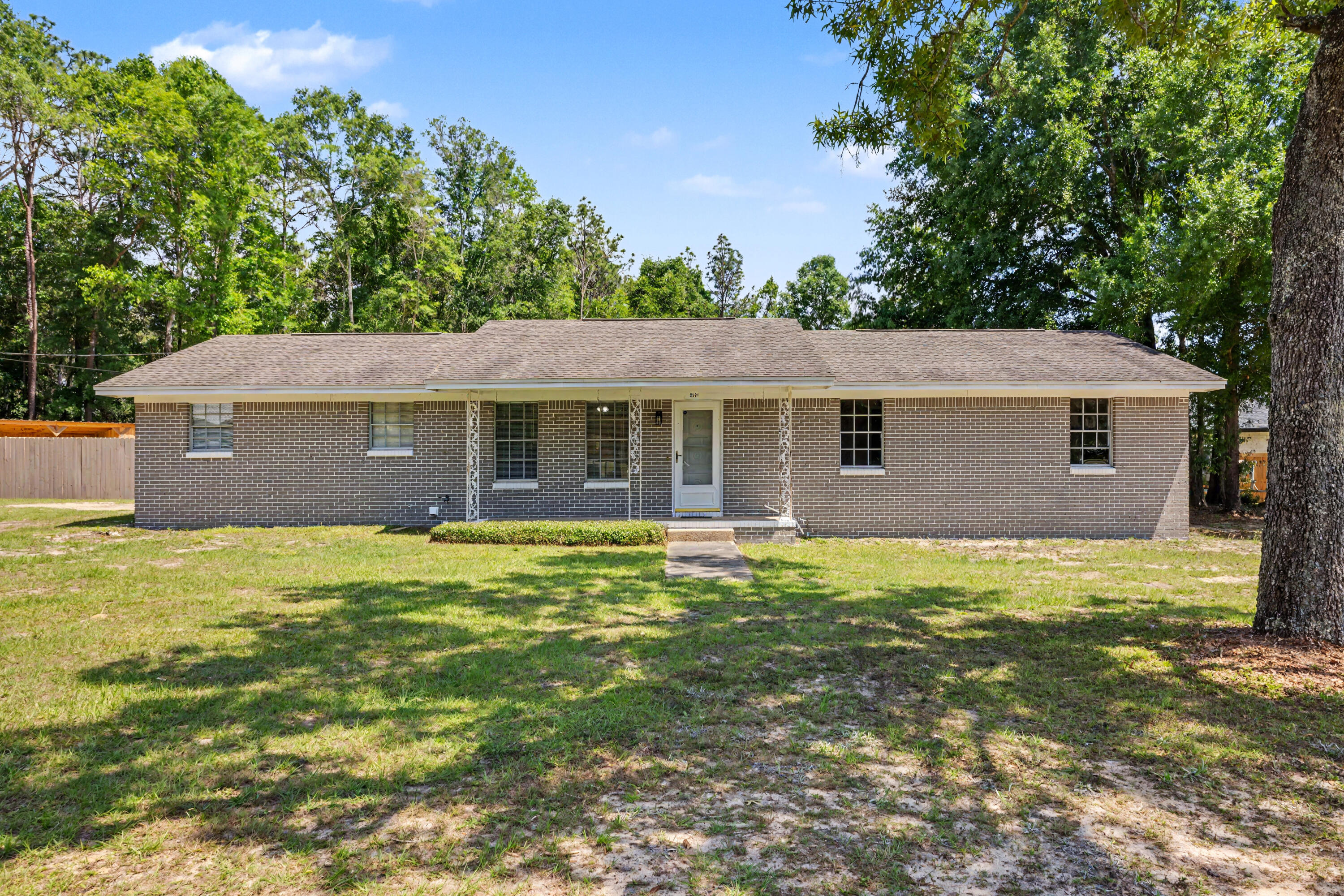 Seller offering $7500 CLOSING CREDIT to buyer with acceptable offer! If you are looking for outdoor space to spread out- this flat, corner lot may be just the one! Over half an acre of cleared land outside of the city limits. The newly built 16'x40' pole barn is perfect for your RV or boat, and the workshop/shed has space for your lawn equipment, 4 wheelers- you name it! The back porch has been screen enclosed and includes a outdoor kitchen and bar overlooking the pool complete with deck pavers and the greenhouse situated on a concrete slab. The fully fenced back yard provides all of the privacy you desire while being just a quick minute from whatever you need in town! Inside features 3 bedrooms and 2 full bathrooms, spacious living room and large den as well as a separate office area. Roof 2017, Water Heater 2018, and HVAC 2013. Schedule a private showing today!