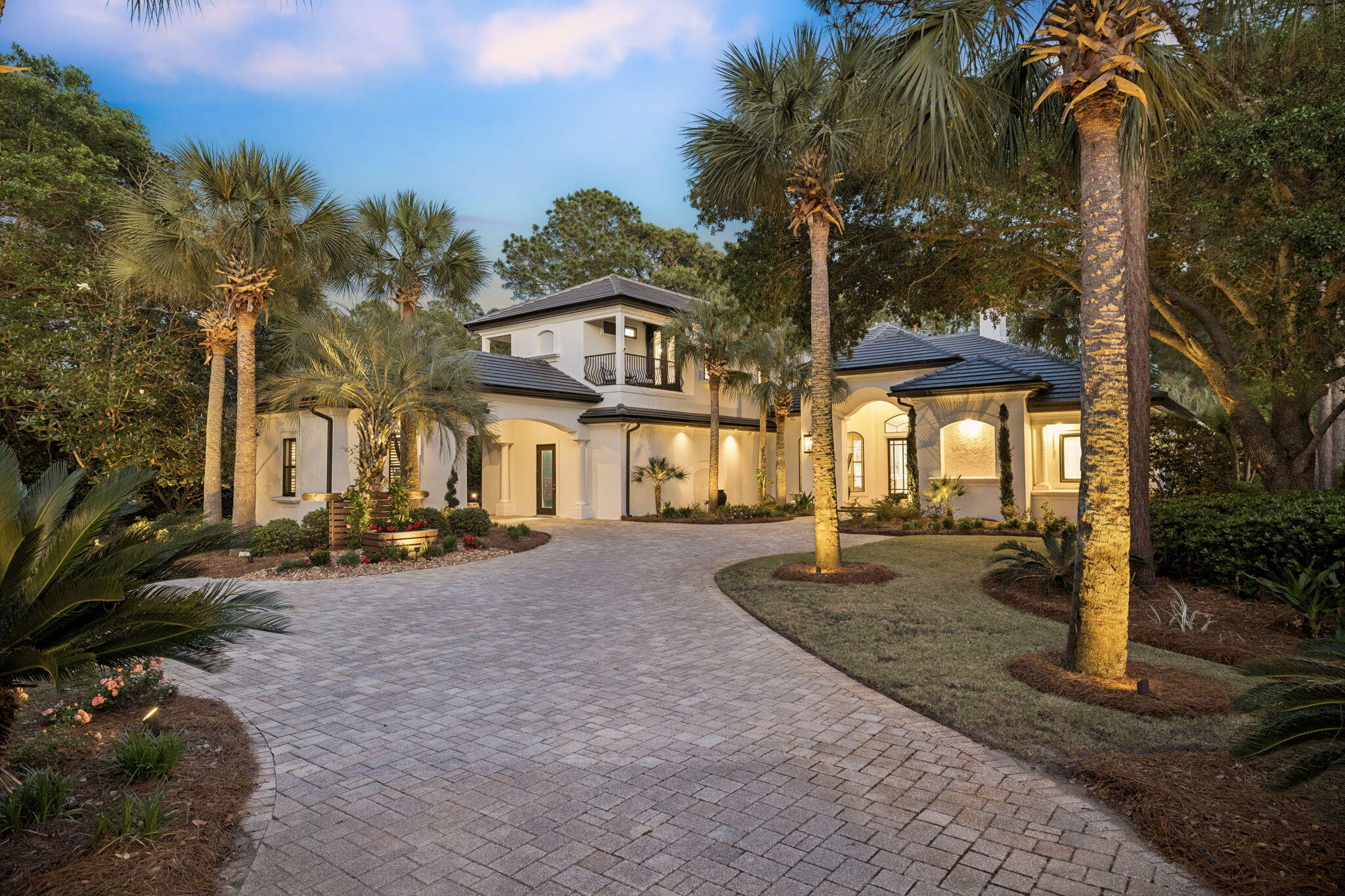 Welcome to a truly exceptional Burnt Pine estate, masterfully designed by renowned builder Maurice Sweet and thoughtfully reimagined to reflect a refined, modern standard of luxury. Set along the 18th fairway of the Burnt Pine Golf Course on nearly three-quarters of an acre, this custom residence pairs timeless architecture with extensive recent enhancements, creating a private retreat that is as functional as it is striking.

From the moment of arrival, the home's presence is undeniable. Stately columns, smooth pavered drives, and a brand new concrete tile roof introduce a timeless architectural presence, while covered parking, an oversized two-car garage, and a dedicated golf cart garage speak to both scale and convenience. A freshly painted exterior and updated architectural detailing further elevate the home's curb appeal, setting the tone for the level of quality carried throughout.

Inside, the home unfolds with a refined, modern aesthetic defined by clean lines, bright, airy finishes, and immense natural light. You're welcomed by a striking formal sitting area, where a floor-to-ceiling picture window frames the expansive outdoor living space, pool, and sweeping golf course beyond, an immediate focal point that draws the eye and sets a sophisticated first impression. Thoughtfully positioned alongside, the formal dining room and adjacent wet bar create an ideal setting for both intimate dinners and elevated entertaining, offering a seamless connection between gathering spaces while maintaining a sense of distinction and elegance.

At the heart of the home, a completely reimagined kitchen blends form and function with remarkable precision. Recently fully renovated, it features custom cabinetry, elevated countertops, and a suite of Thermador appliances, thoughtfully designed to support both casual gatherings and elevated culinary experiences. A statement design moment in its own right, the kitchen pairs refined finishes with an intentional layout, serving as both a visual centerpiece and a natural gathering place within the home. The adjacent living spaces flow seamlessly, enhanced by updated built-ins, curated finishes, and a whole-home Sonos sound system that brings a cohesive sense of modern living.

Designed to fully embrace the outdoor lifestyle that defines Sandestin, the exterior living spaces feel like a private retreat within the resort. The newly enhanced outdoor kitchen anchors the covered entertaining area, complete with custom cabinetry, upgraded appliances, and generous space for gathering. Just beyond, the outdoor living and dining area invites year-round enjoyment, anchored by a fireplace and television, perfectly suited for relaxed evenings, game days, or effortless entertaining in every season. Enhanced by multiple new ceiling fans and beautiful pecky cypress beams, the space is designed to remain comfortable and inviting even in the height of summer.

The saltwater pool and spa are surrounded by lush, tropical landscaping that brings a sense of seclusion and serenity, creating an atmosphere that feels worlds away, more akin to a private island oasis than a traditional backyard. Thoughtfully updated pool equipment, including a new pump, heater, and lighting, ensures both beauty and performance. As evening falls, an extensive landscape lighting design further enhances the home's resort-like ambiance, casting a warm, inviting glow across the entire setting and elevating the experience well into the night.

The first-floor primary suite offers a private retreat, thoughtfully positioned with direct access to the pool deck for seamless indoor-outdoor living. Generously scaled and finished with luxurious carpeting underfoot, the bedroom provides a quiet sense of comfort and refinement. The primary bath has been entirely reimagined, featuring expansive counter space with an integrated vanity, dual sinks, an elegant soaking tub, and a stunning separate shower with custom tile work, creating a spa-inspired environment designed for both relaxation and everyday indulgence.

Additional first-level spaces are thoughtfully designed to support both everyday living and effortless entertaining, including a well-appointed powder bath conveniently located off the formal gathering areas and a dedicated pool bath for added ease. A private study or flex space offers versatility to suit a range of needs, while a spacious laundry room with custom built-ins and ample counter space enhances daily functionality. Two additional guest bedrooms on the main level offer generously sized, well-appointed accommodations, providing both comfort and privacy for family and guests alike. A striking stone-walled wine cellar designed to accommodate up to 238 bottles alongside a wine refrigerator and additional storage for wine crates serves as both a functional amenity and a refined focal point within the home.

Step into the convenient wood-paneled elevator for effortless access to the second level, where a spacious loft-style suite offers a flexible and inviting retreat. Complete with a full bath featuring dual sinks, the space is thoughtfully designed with custom-built alcoves that serve as charming sleeping quarters or quiet reading nooks, adding both character and versatility. A beautifully appointed den with custom built-ins and comfortable, lounge-style seating creates a warm and welcoming gathering space. An additional private bedroom with its own en suite bath provides well-appointed accommodations for guests, while a conveniently located wet bar enhances the functionality of the level, ideal for hosting or relaxed evenings in. Outdoor living continues with a private balcony at the front of the home and an expansive rear terrace overlooking the pool and golf course, offering multiple vantage points to take in the surroundings.

Extensive recent improvements further enhance the home's turnkey appeal, including a new roof installed in 2025, all new gutters and eaves, updated HVAC systems, and a new tankless water heater. The home has been freshly painted inside and out, and thoughtfully updated complemented by new kitchen appliances and a new washer and dryer. Together, these enhancements provide a level of quality, comfort, and peace of mind that allows the next owner to enjoy the home for years to come.

Located within the exclusive, gated enclave of Burnt Pine, residents enjoy access to the most prestigious neighborhood within Sandestin Golf and Beach Resort. Spanning over 2,400 acres from the bay to the beach, the resort offers miles of golf cart and pedestrian pathways winding through lush landscapes and along scenic lagoons, seamlessly connecting an array of world-class amenities. Championship golf, tennis and pickleball, a full-service marina, and the vibrant Village of Baytowne Wharf for dining, shopping, and year-round events are all within reach. Just beyond the gates, Grand Boulevard and the Market Shops at Sandestin provide an additional layer of dining, retail, and everyday convenience.

This is a home where timeless design meets modern refinement, offering a level of privacy, quality, and lifestyle that is truly exceptional within Burnt Pine.
