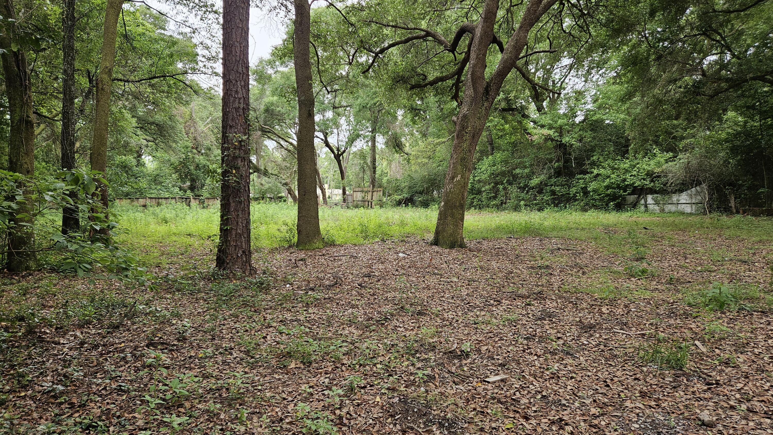 High Density Mixed Use (HDMU) zoning offers exceptional flexibility, allowing for residential uses including single-family and manufactured homes while also providing the potential for compatible neighborhood retail, service, and professional office uses in accordance with Escambia County regulations. Build your dream home or place a new manufactured home on this spacious, mostly cleared lot just under half an acre! Surrounded by mature oak trees and located in a quiet area, this property offers a great blend of privacy and convenience. Previously improved with a mobile home, the lot has water and electrical taps available, and a septic system is believed to remain on site. With utilities already in place and much of the site preparation complete, this property provides an outstanding head start for your next project. Owner financing may be available with acceptable terms. Buyer should verify all information, including zoning, utilities, septic condition, and intended use.