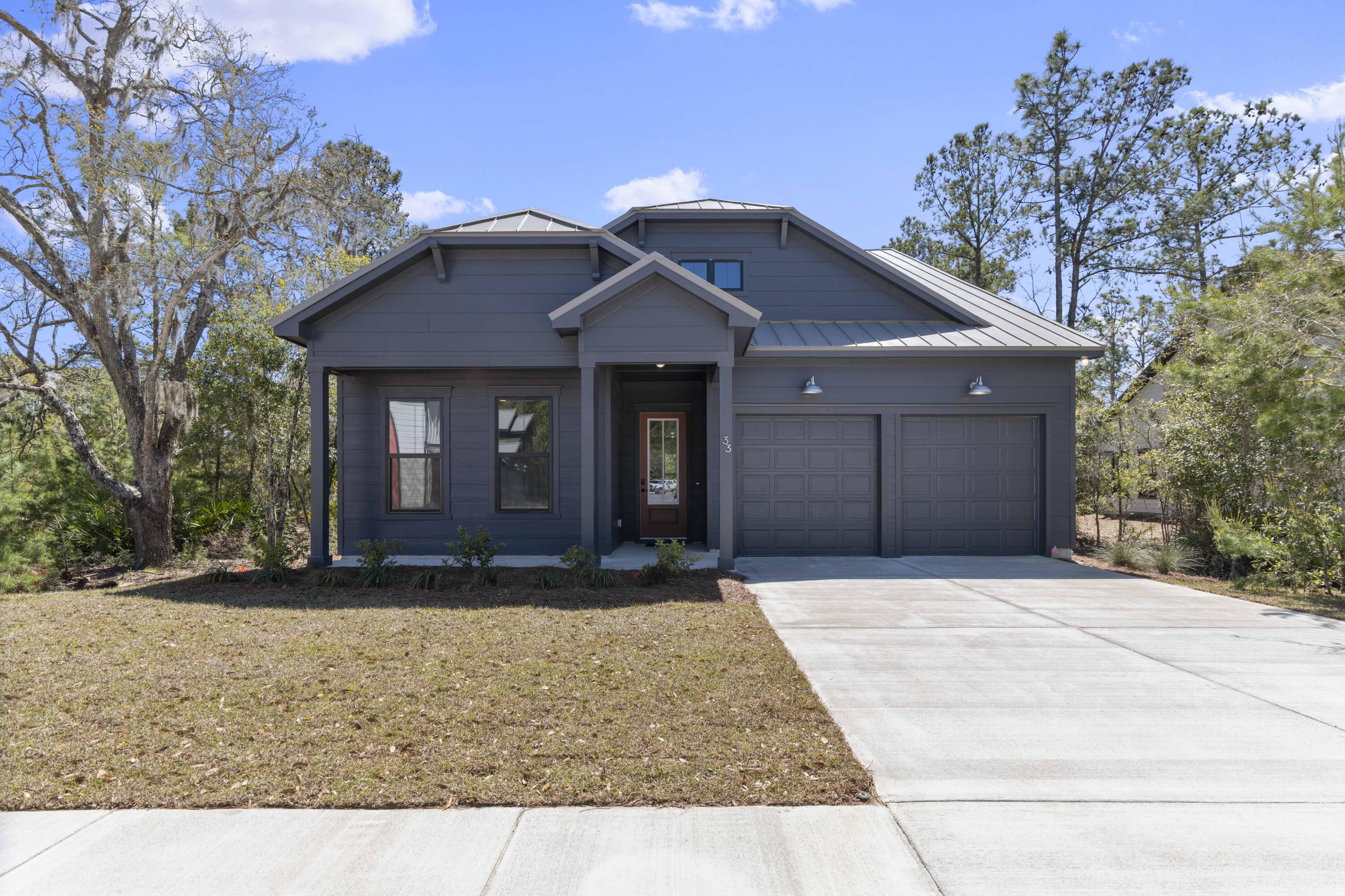 Welcome to The Shoal, a thoughtfully curated new neighborhood where peaceful surroundings & everyday convenience come together. Tucked along the edge of the expansive Point Washington State Park, this intimate community features just 30 homesites, each carefully planned to offer a sense of privacy, space, and a seamless connection to nature. Located only a short drive from Seaside, Grayton Beach, and the iconic 30A corridor, The Shoal places you near some of the Emerald Coast's most beloved destinations while still providing a quiet, nature-inspired retreat. Designed to reflect the natural beauty of the area, homes in The Shoal feature earthy tones, a tranquil community pond, and many homesites that back directly onto preserved state park land. The Venice floor plan offers 3-4 bedrooms and 3 full baths, with an open-concept main living area, a bright sunroom downstairs, and a spacious loft upstairs, perfect for an additional living space, office, or playroom. High-end features come standard, including a metal roof, impact-rated windows and doors, quartz countertops, luxury vinyl plank flooring throughout all common areas and bedrooms, 8-foot doors on the main level, and a gas range with a vented hood in the kitchen. Homeowners also enjoy the opportunity to personalize their new home by selecting finishes and upgrades during their design appointment, making each home in The Shoal as unique as its setting. *Prices may vary based on upgrades and lot selection.* This listing shows the base price of this home. Photos are not of this exact home. Home does not come furnished.**