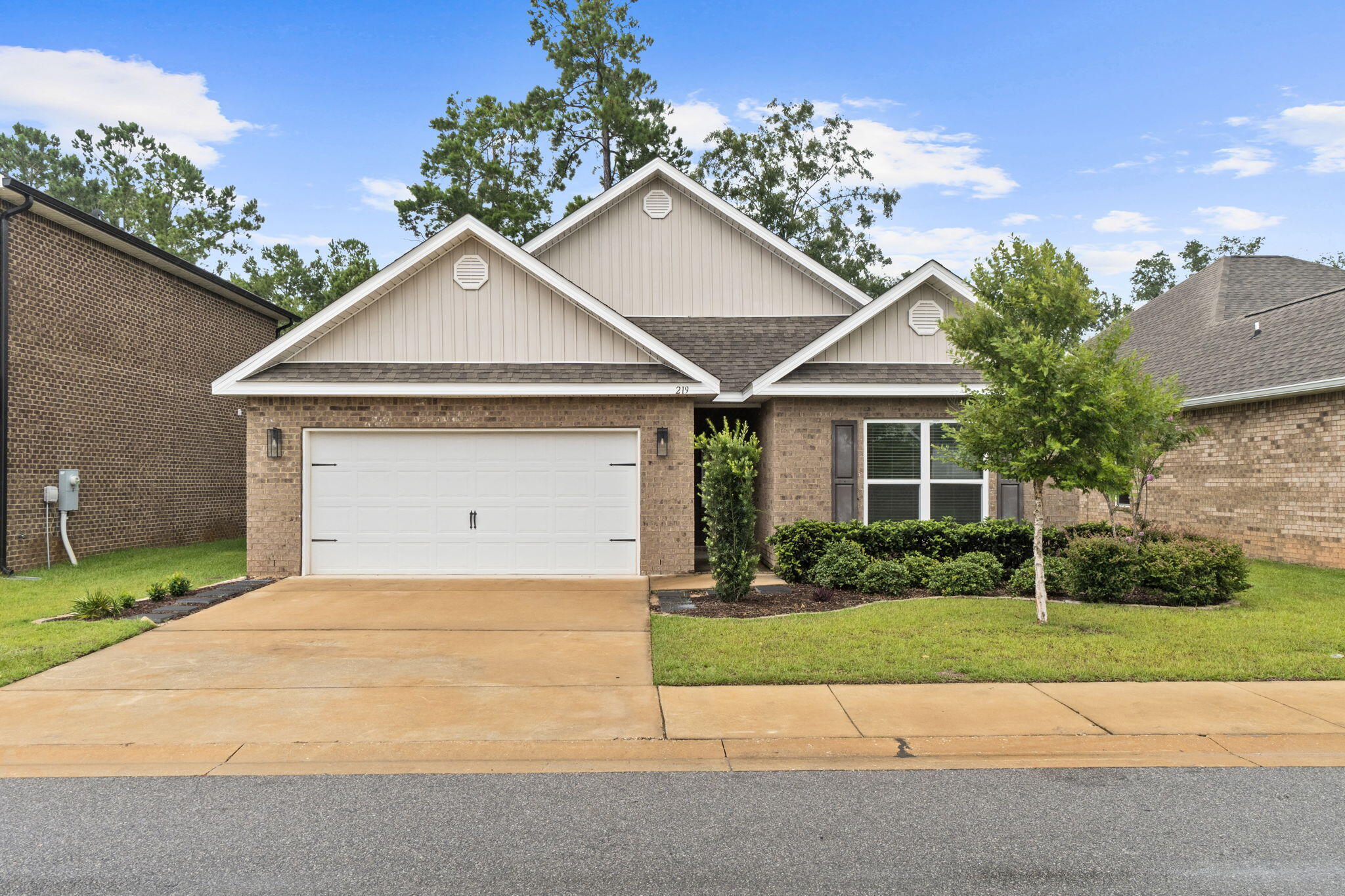 **Welcome to 219 Beaver Trail, nestled in the charming community of Live Oak Harbour.** Surrounded by beautiful mature trees and located just one mile from the Freeport Marina, this peaceful neighborhood offers the perfect blend of natural beauty and convenience. This thoughtfully designed **Delray** floor plan features a spacious single-story layout that maximizes both comfort and functionality. The open-concept kitchen overlooks the expansive great room and dining area, creating an ideal space for entertaining or everyday living. Just beyond, the oversized covered patio extends your living space outdoors, perfect for relaxing or hosting family and friends.
The home offers **4 generously sized bedrooms, 2 full bathrooms, and an exceptionally large laundry room** with plenty of space for storage and organization. Completing the package is a **spacious two-car garage**, providing ample room for vehicles, tools, and recreational equipment. If you're looking for a move-in-ready home in a quiet, established neighborhood just minutes from boating, fishing, dining, and the sugar-white beaches of the Emerald Coast, **219 Beaver Trail is a must-see.