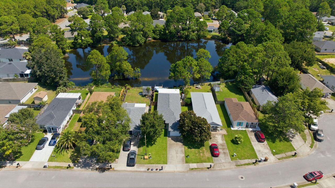 Welcome to this Lakefront home that has been beautifully updated and meticulously maintained. The home has 3-bedroom, 2-bath featuring a desirable split-bedroom floor plan. The spacious primary suite offers a large walk-in closet, dual vanities, and plenty of room to relax. Both bathrooms include their own linen closets, providing added storage and convenience.

The one-car garage features an automatic garage door opener, keypad entry, and attic access for additional storage. Outside, you'll appreciate the beautifully manicured lawn with a full sprinkler system, making maintenance a breeze.

Step onto the back screened in patio and take in the peaceful lake views. Privacy fencing extends down both sides of the yard all the way to the water's edge, creating a secluded outdoor retreat perfect for relaxing or entertaining. Watch the ducks glide across the lake as you enjoy the tranquil setting.

From the moment you walk through the front door, you'll be impressed by the care and attention this affordable lakefront home has received. Combining comfort, privacy, and scenic waterfront living, this is a home you won't want to miss!