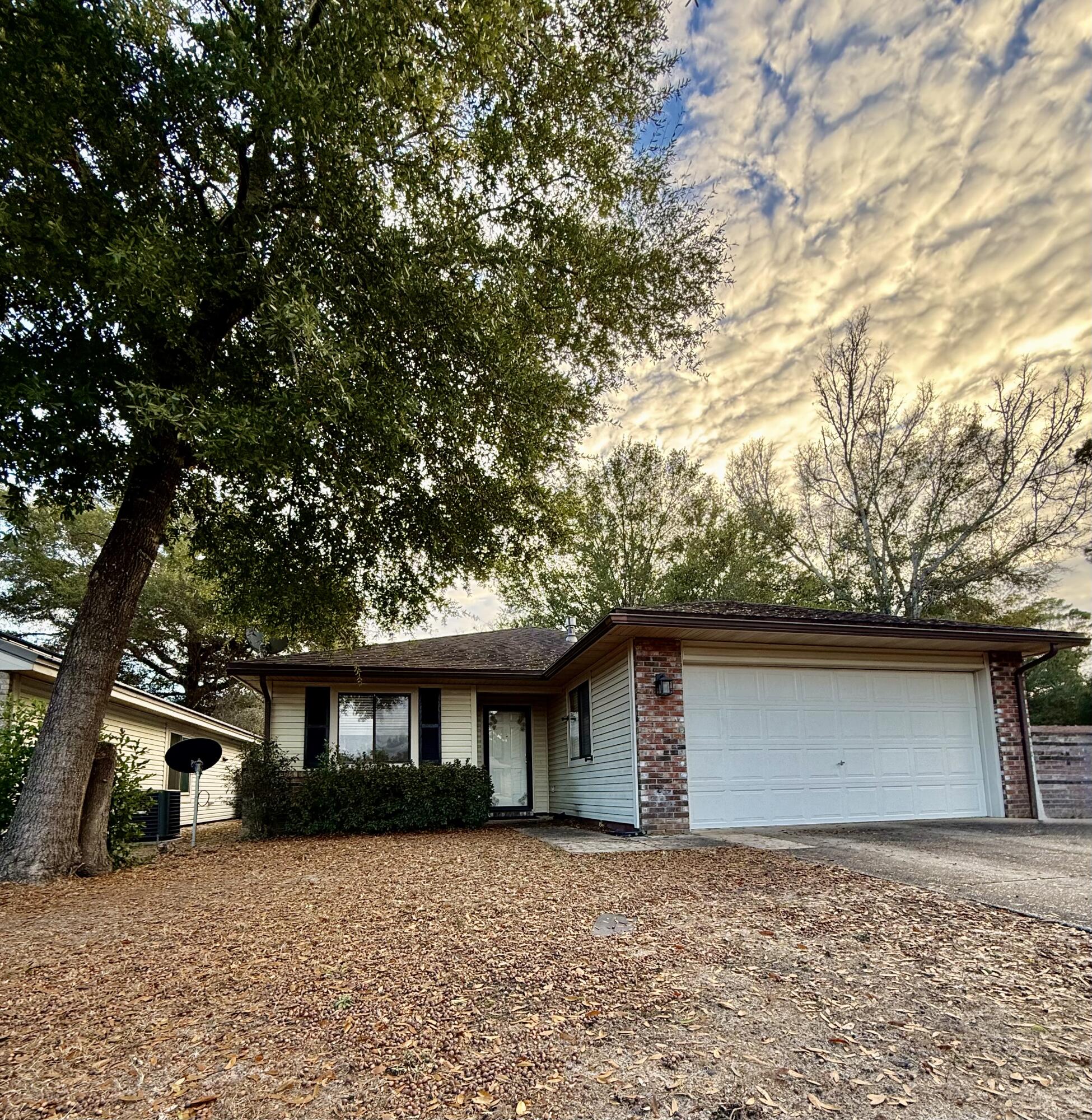 This home has been renovated with vinyl wood plank floors throughout for easy maintenance, some new light fixtures and updated kitchen.  Corner lot conveniently located.  This home is a split floor plan with cathedral ceiling.  Home has 2 Car garage. Home is within walking distance to college, middle school, park, library, high school, restaurants and sports complex making this the perfect rental .   Owner is a licensed Real estate agent. No Dogs. No animals.  Text Marsha Thomas-Curry at 850-240-2861