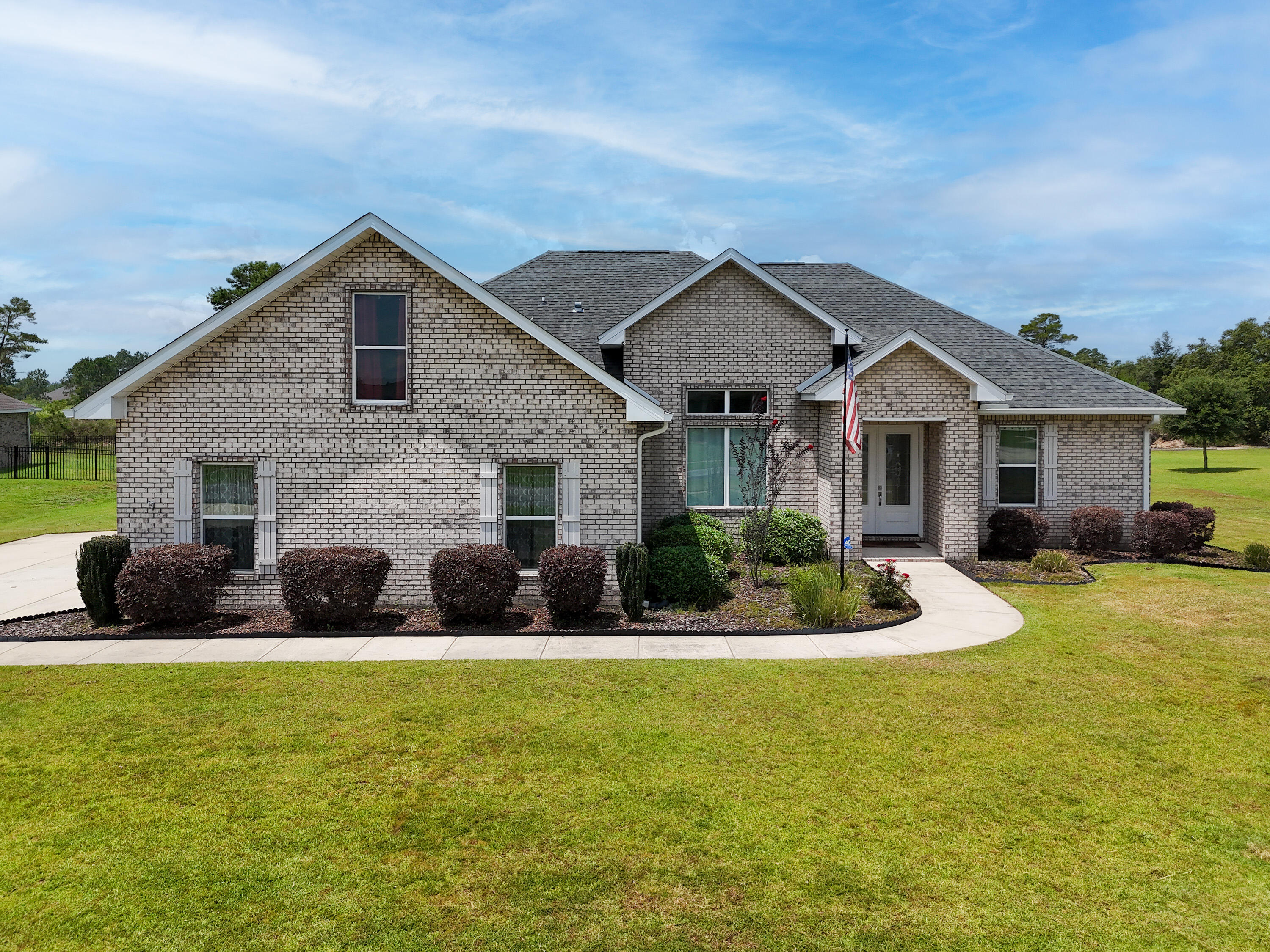 *Under contract with a kickout clause in place.* IMPROVED WITH A NEW PRICE! Take advantage of a rare VA assumable loan at just 3.5% (approximately $426,000 balance, subject to VA eligibility and lender approval). This custom-built 4-bedroom, 2-bath home is ideally situated on a quiet cul-de-sac in the sought-after Windswept Dunes Golf Community, offering minimal through traffic and added privacy. Nestled on a spacious .63-acre lot, there's plenty of room to build the backyard pool of your dreams. Inside, you'll find all new luxury vinyl plank flooring, fresh interior paint, and new stainless steel kitchen appliances, making this home truly move-in ready. The gourmet kitchen features custom cabinetry, a large quartz island, and abundant prep space for entertaining. The private primary suite boasts an oversized tiled shower and an impressive walk-in closet. Upstairs, the large bonus room over the garage offers endless flexibility as a media room, home office, playroom, or guest retreat. Step outside to the covered back porch where the hot tub conveys, creating the perfect place to relax after a long day. Residents enjoy resort-style amenities including a clubhouse, swimming pool, tennis and pickleball courts, playground, food truck nights, community events, and a championship golf course. Don't miss this incredible opportunity to own a beautifully updated custom home with an unbeatable assumable interest rate!