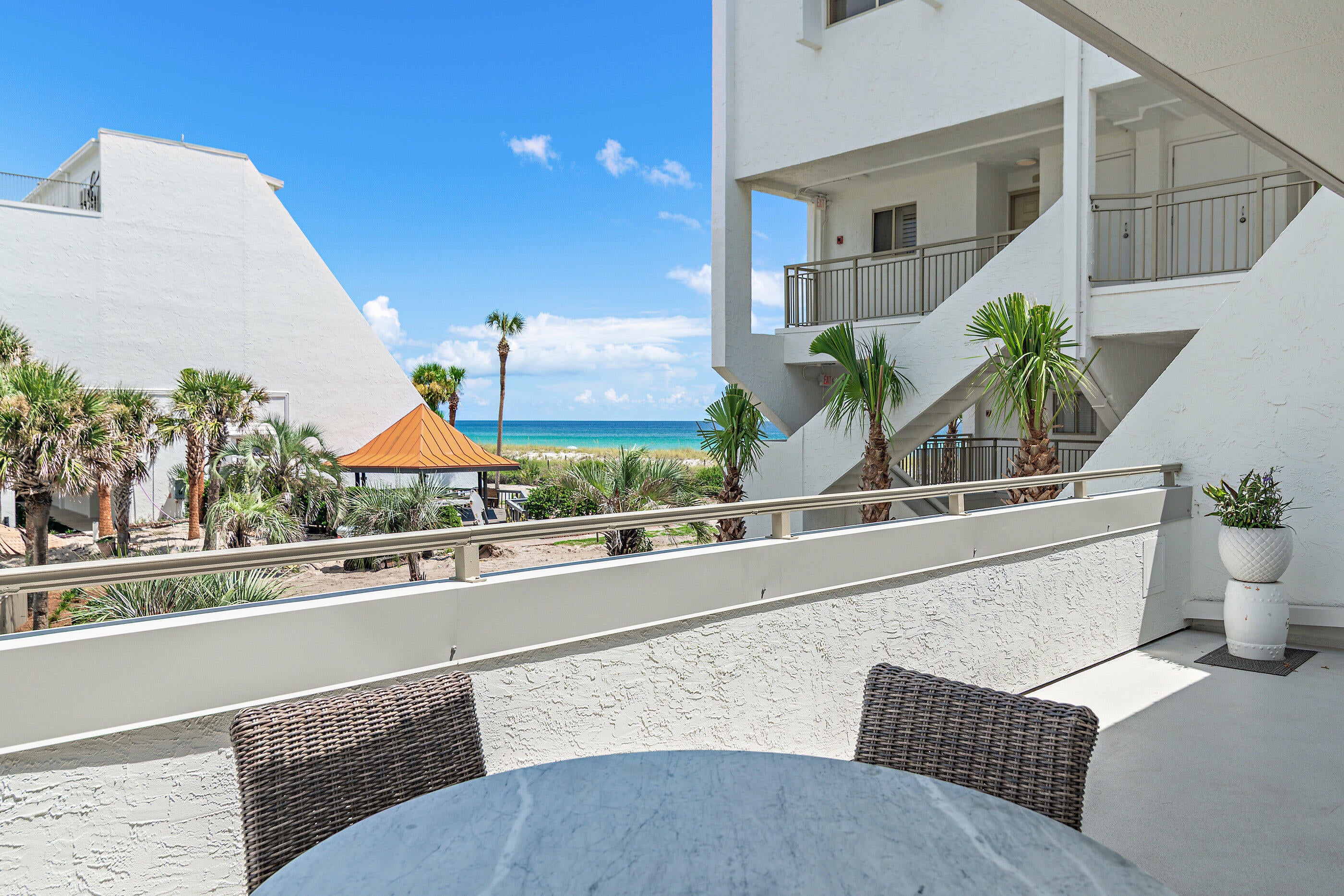 This 2 bedroom, 2 bath condo is what you've been searching for. Freshly renovated and move-in (or rent-out) ready. This one checks every box: space, privacy, and a beach that never feels crowded. The open floor plan got a full refresh: new paint, wood look tile throughout, granite counters, white cabinets, stainless steel appliances, and all new furniture and accessories. Just bring your toothbrush.
Step out onto your own private 200 square foot balcony for gulf views over the pool. Coffee at sunrise, dolphins playing offshore, need we say more? And the beach? 500 feet of private deeded beach means one chair setup per spot, no one crowding your view. Add in a brand new bar area, barbecue grills, tennis and pickleball courts, gated access, and plenty of parking, and you've got the kind of place people daydream about at their desk job.

Size. Privacy. Views. This one has it all.